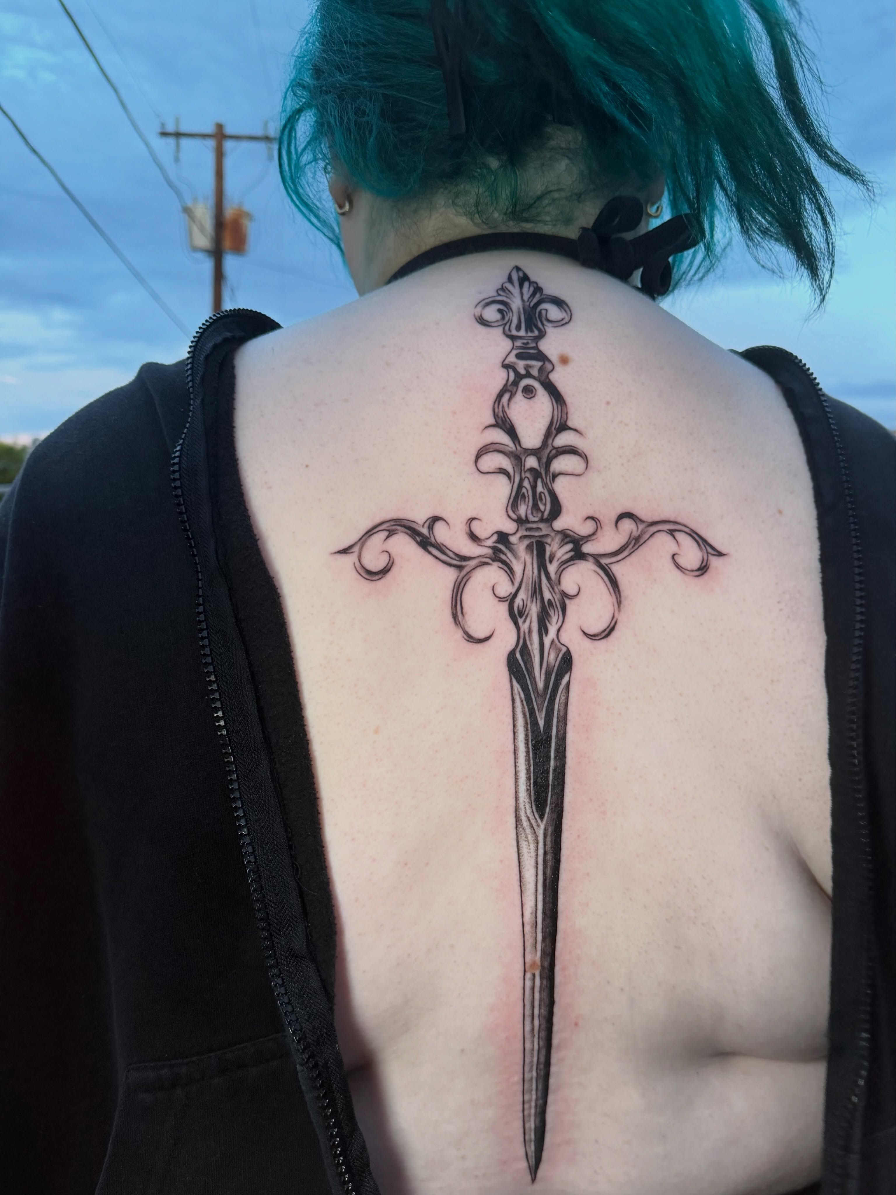 Sword geometric tattoo on the back by tattoo artist (mollz)