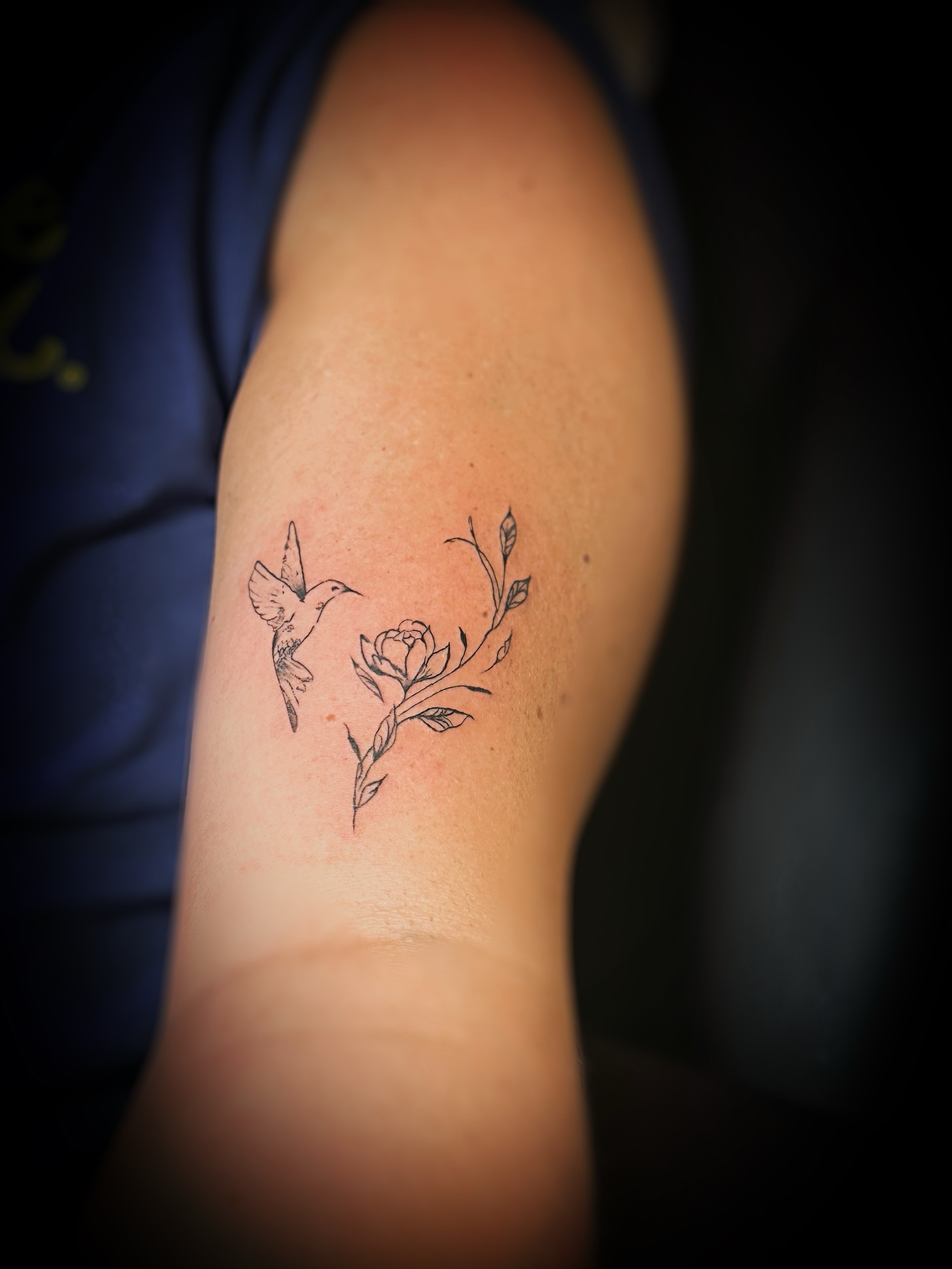 Hummingbird and rose black and grey tattoo on the forearm by Meagan, Charlotte, North Carolina