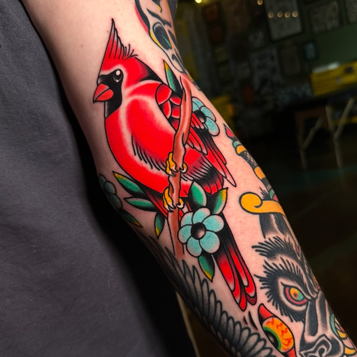 Cardinal bird American traditional tattoo on the forearm by Schyler Ames, Canal Fulton, Ohio