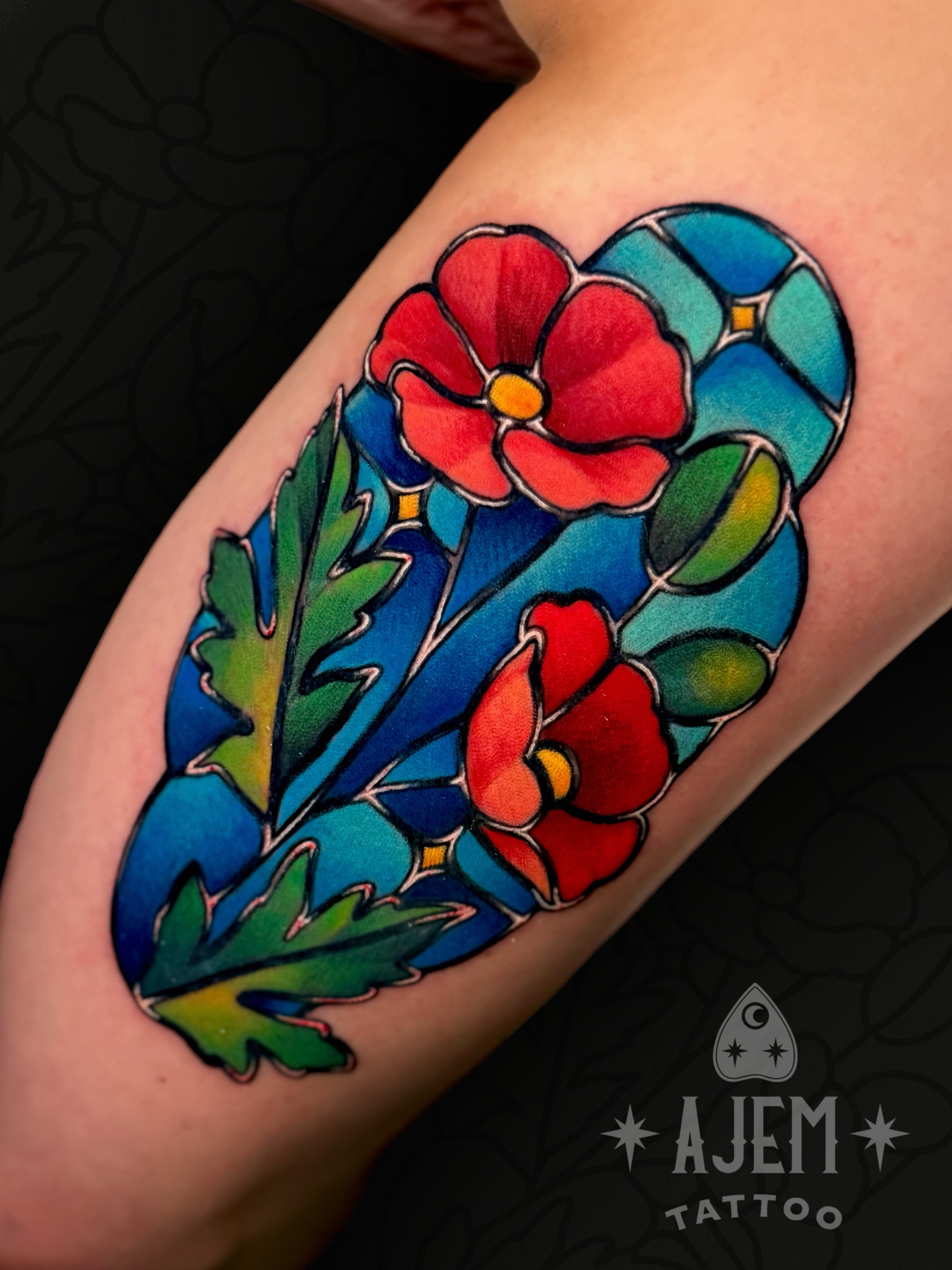 Flowers American traditional tattoo on the forearm by Ash MacIsaac