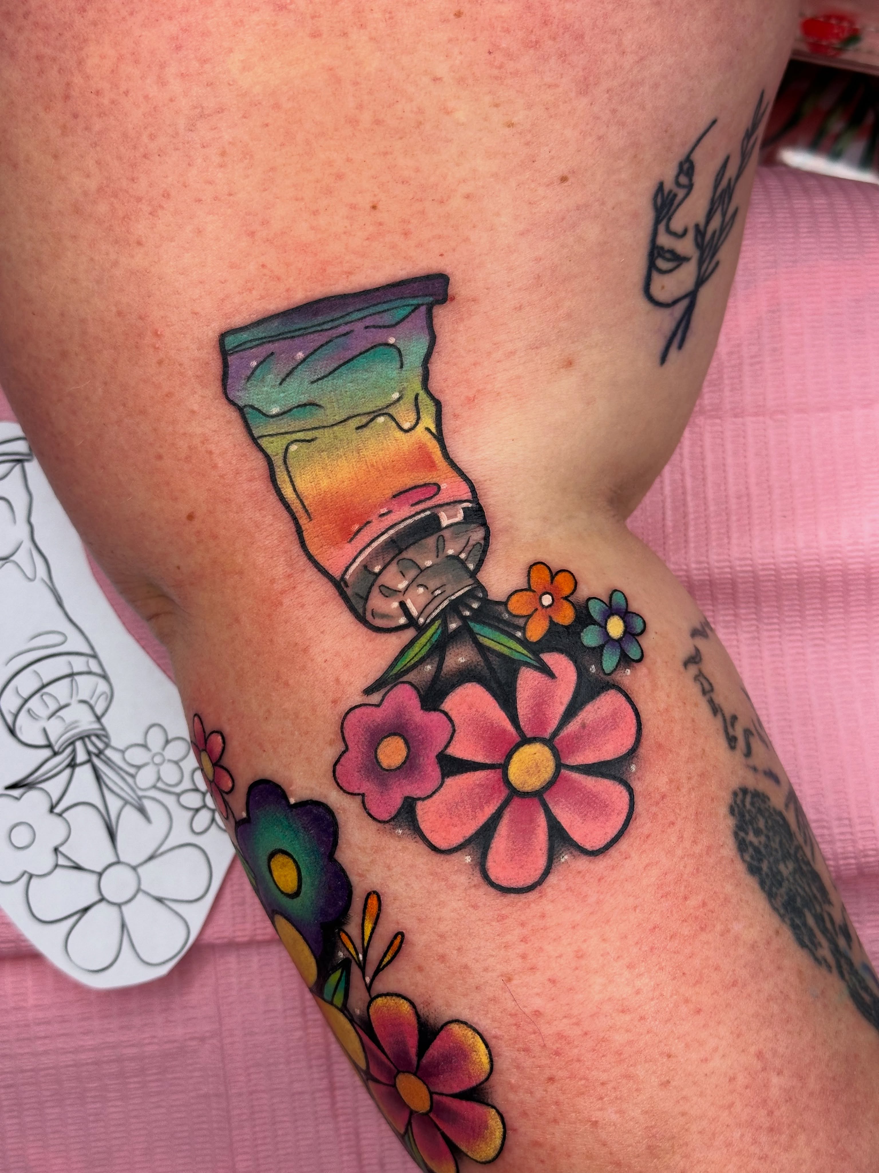 Flower spray bottle new school tattoo on the forearm by Isabel