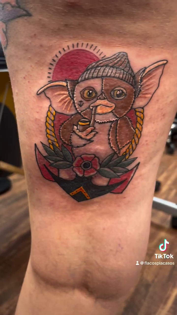 Gremlins characters on an anchor neo-traditional tattoo by Eli Flores