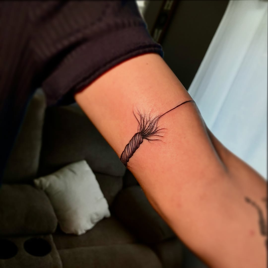 String black and grey tattoo on the forearm by ๐ต๐๐๐๐๐๐๐ ๐ป๐๐๐๐