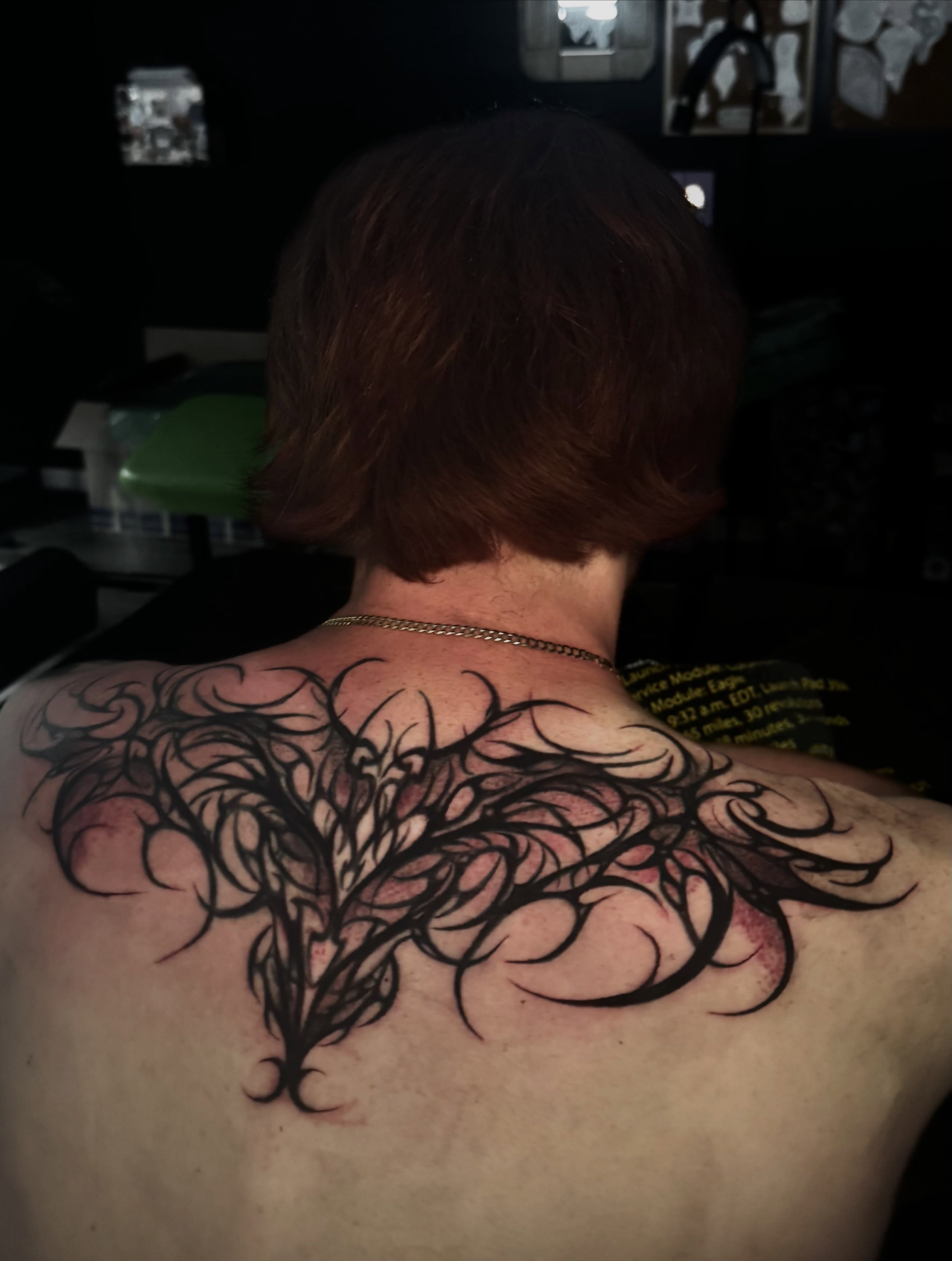 Wing tribal tattoo on the back by Alle