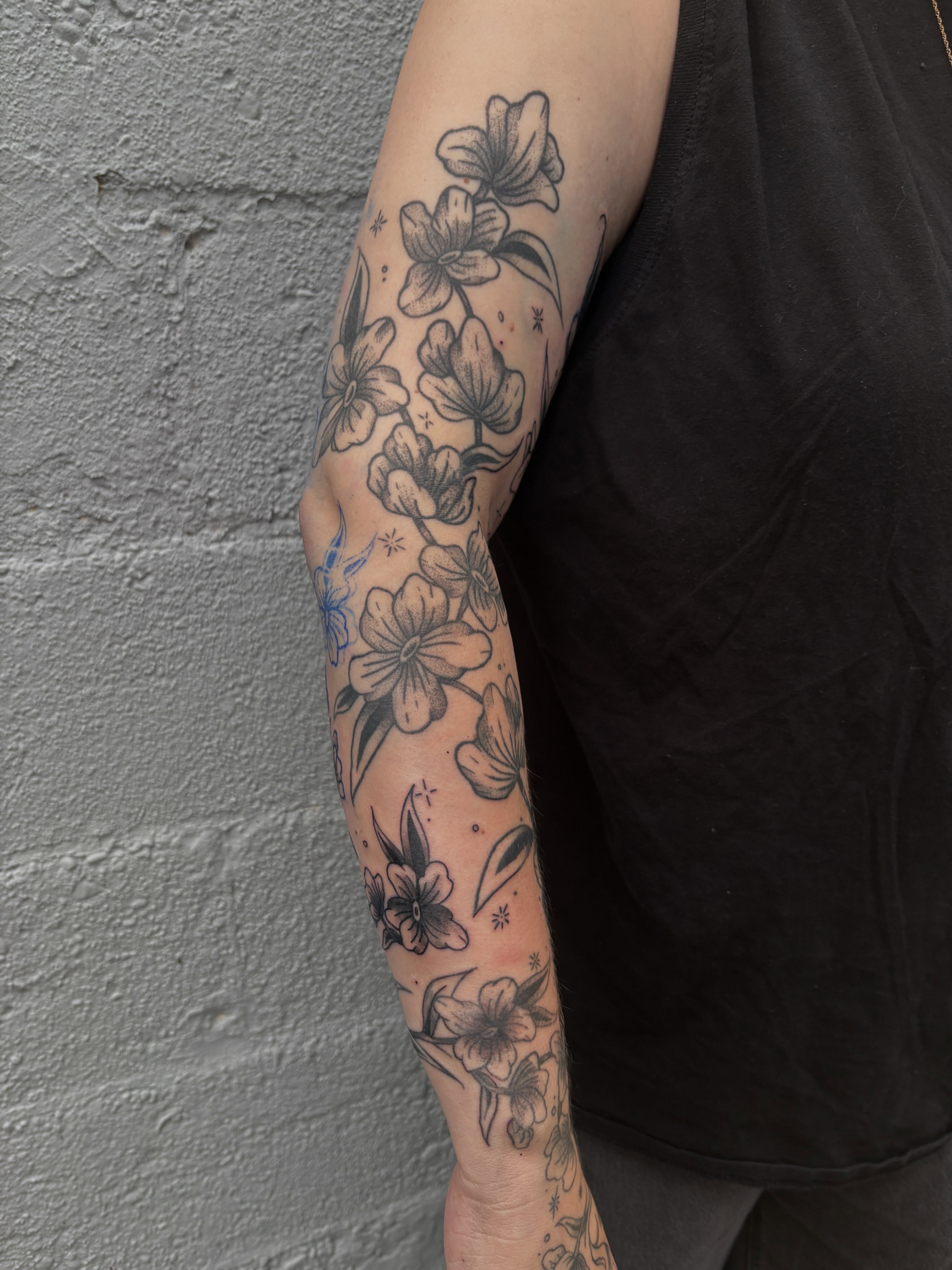 Floral bouquet black and grey tattoo on the forearm by ⋆.˚ ☾ .⭒˚ alaina