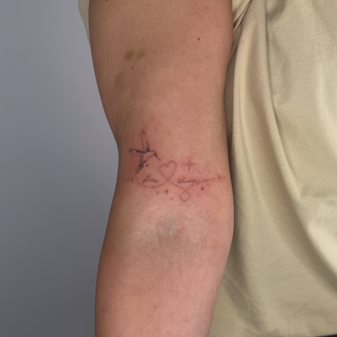 Bird and heart fine line tattoo on the forearm by DFW Fineline Tattoo Artist