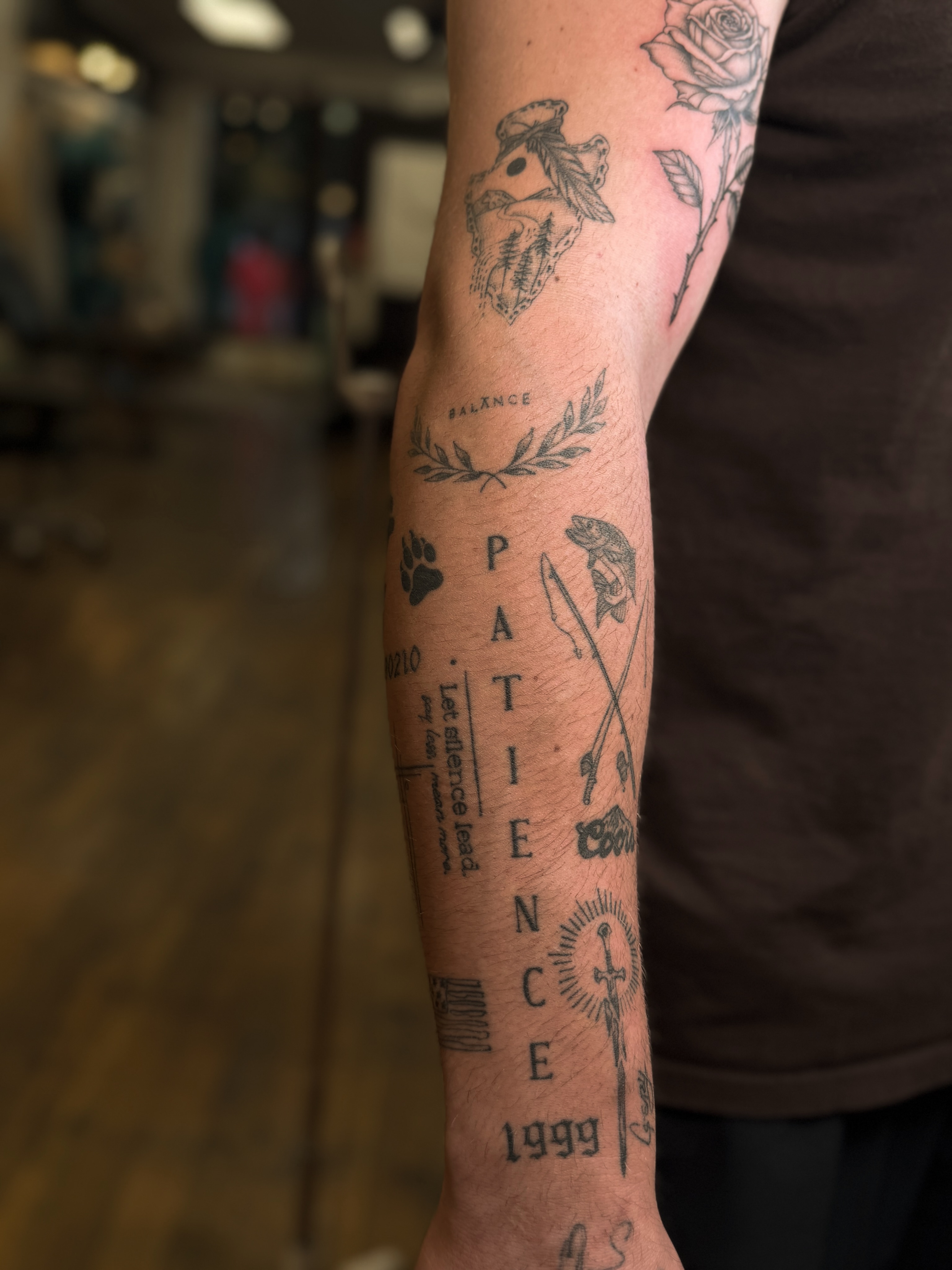 Patience black and grey tattoo on the forearm by Courtney
