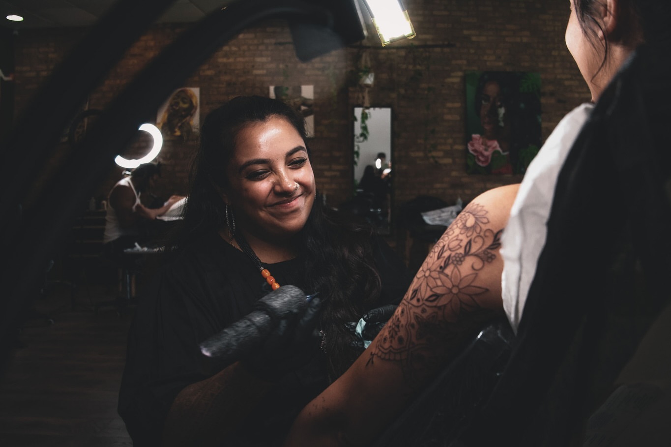 Floral design black and grey tattoo on the forearm by Sabreena Haque