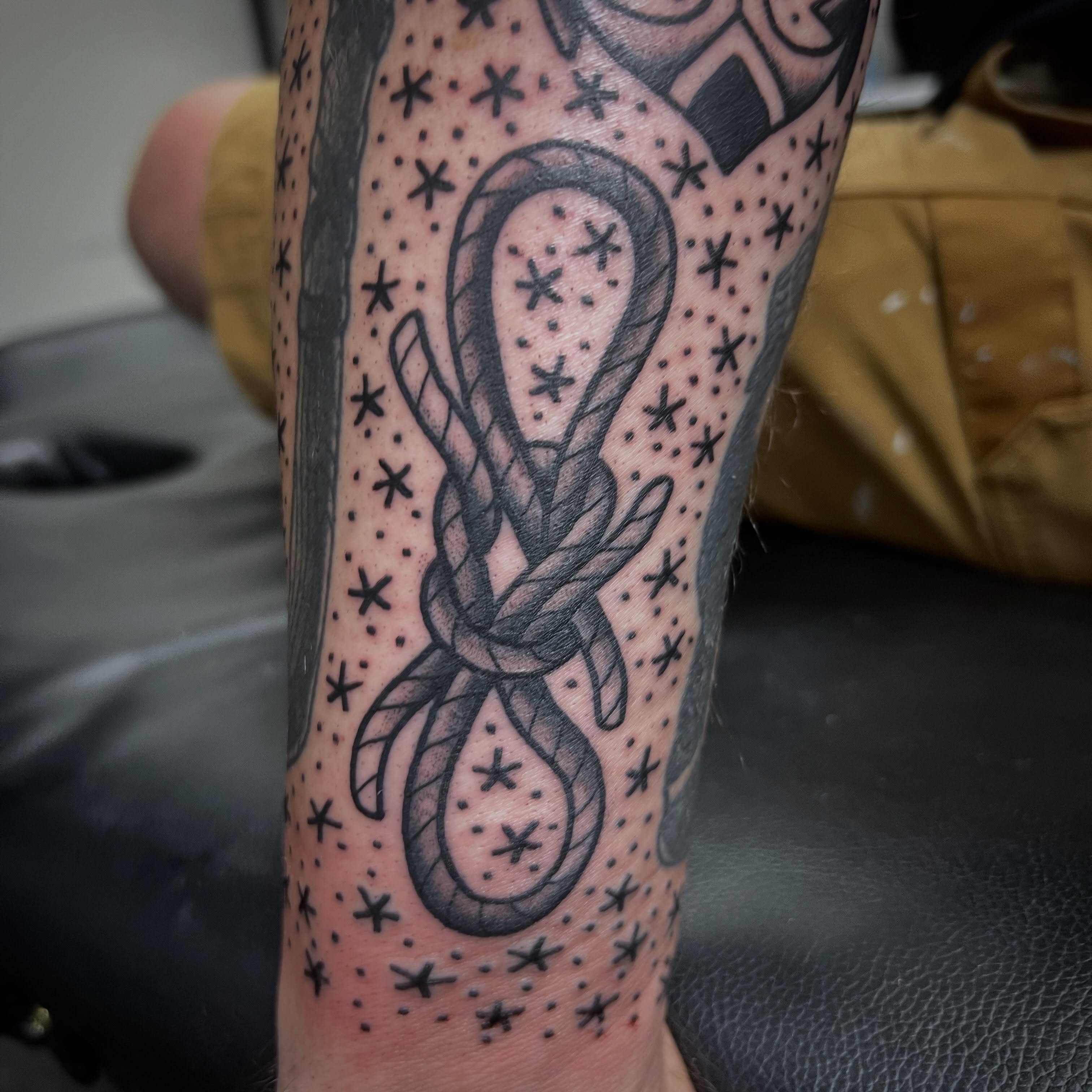 Knot dotwork tattoo on the forearm by Taylor Estrella