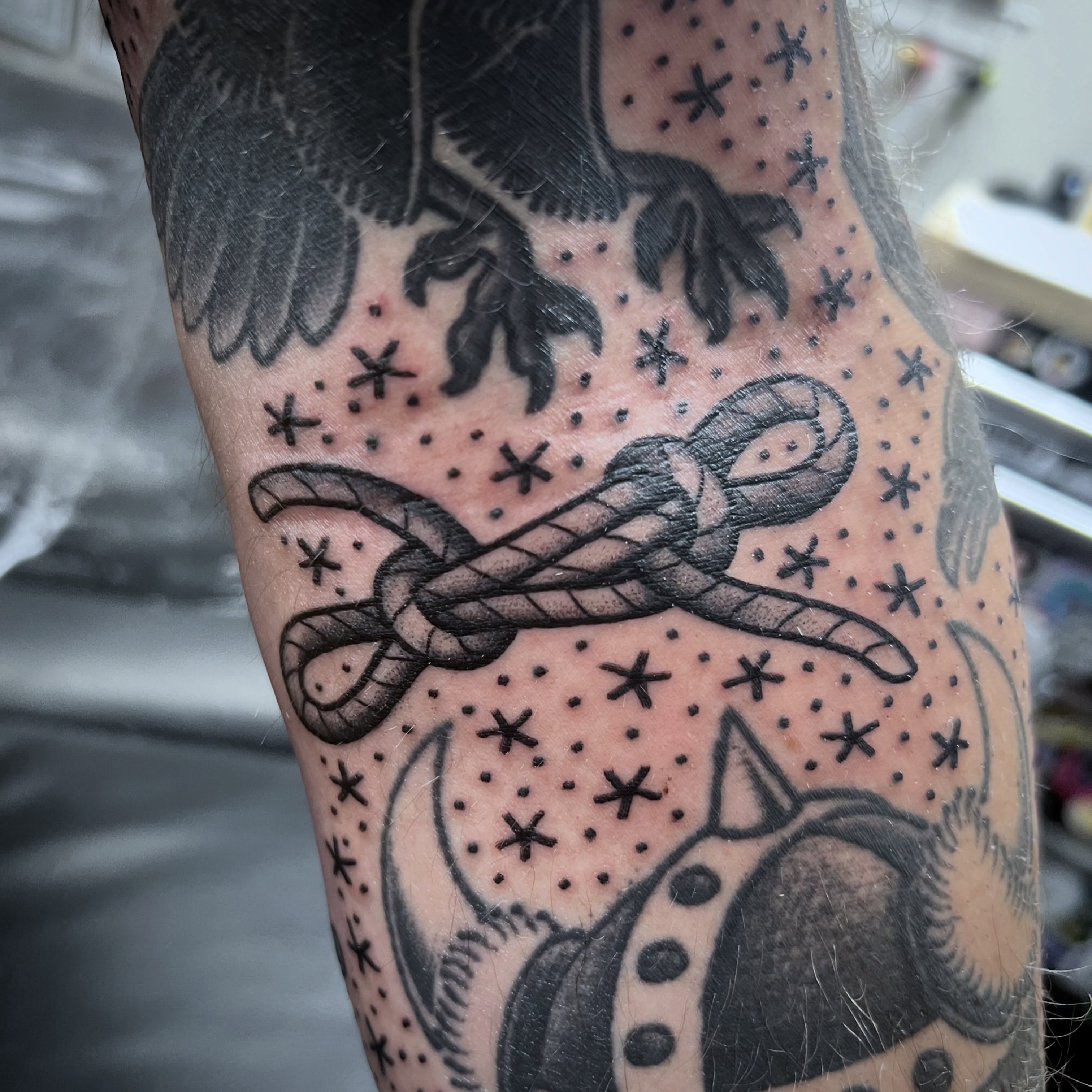 Rope knot black and grey tattoo on the forearm by Taylor Estrella