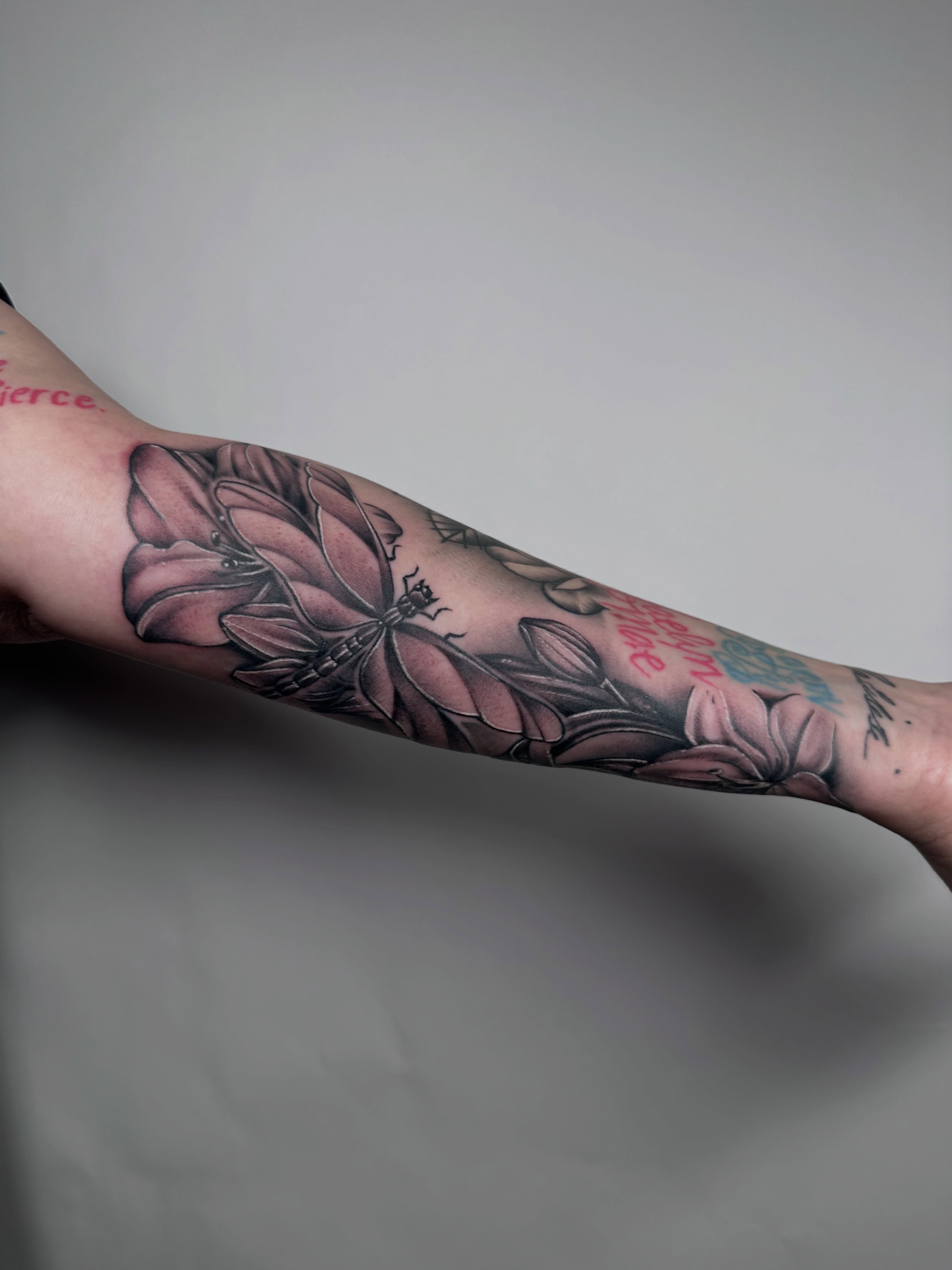 Flower black and grey tattoo on the forearm by Heather Cherish