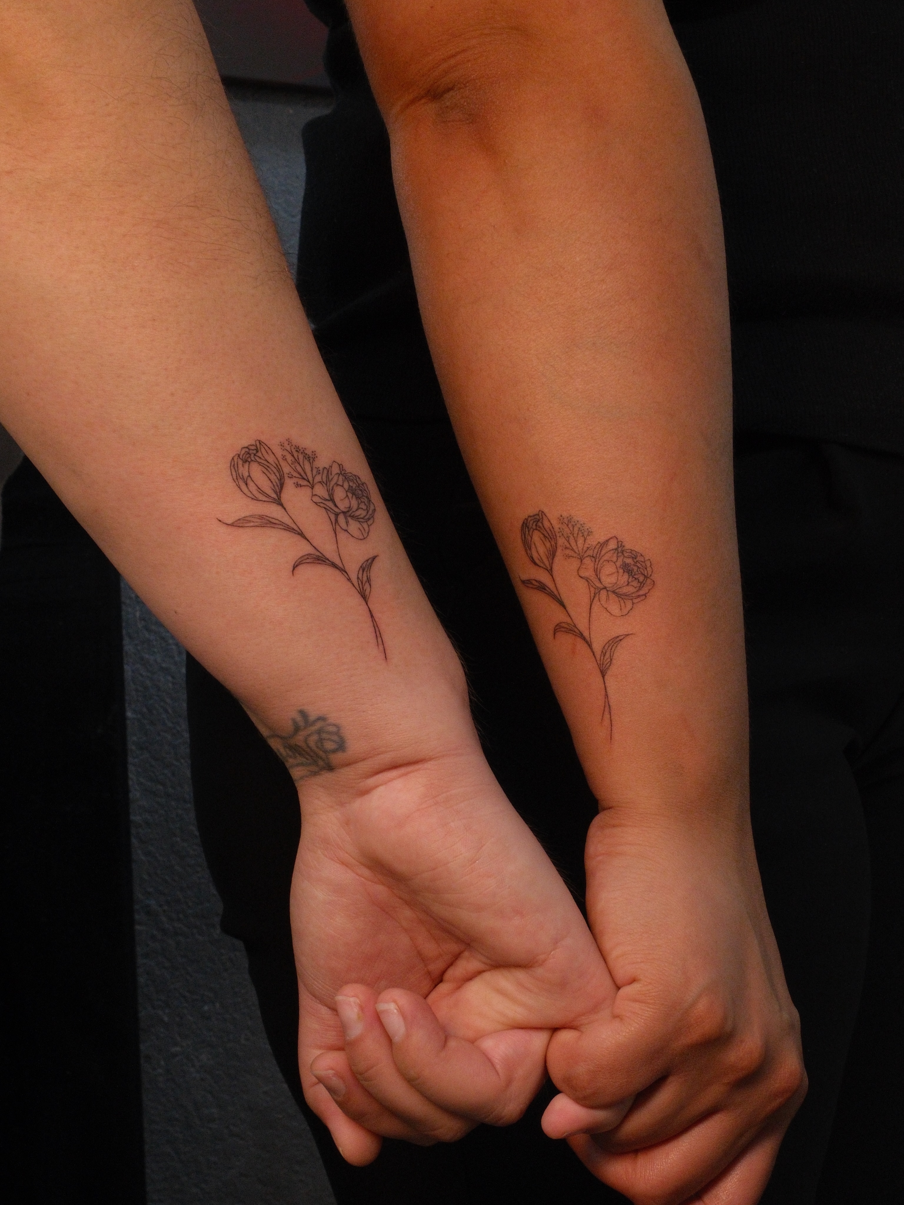 Peony black and grey tattoo on the forearm by Luisa Duarte