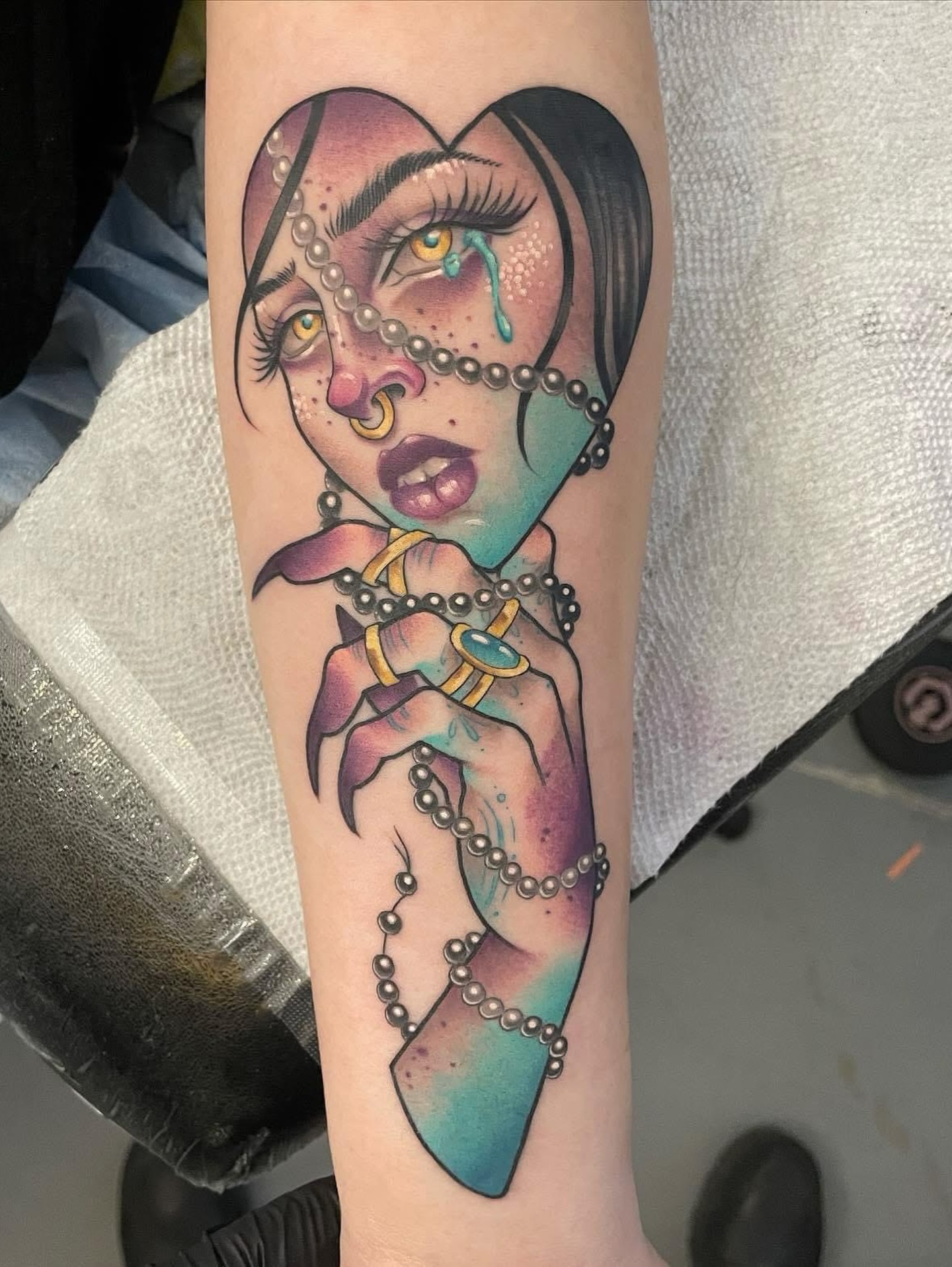 Woman with crystal illustrative tattoo on the forearm by Sam Castro