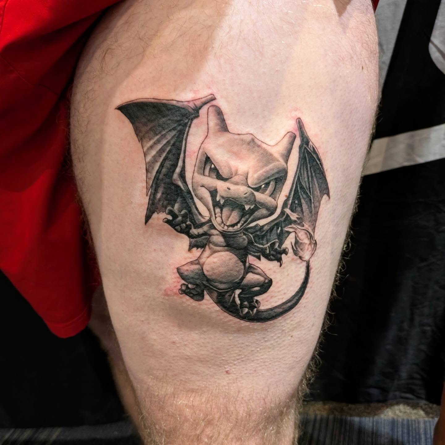Demon black and grey tattoo on the thigh by James Mullin