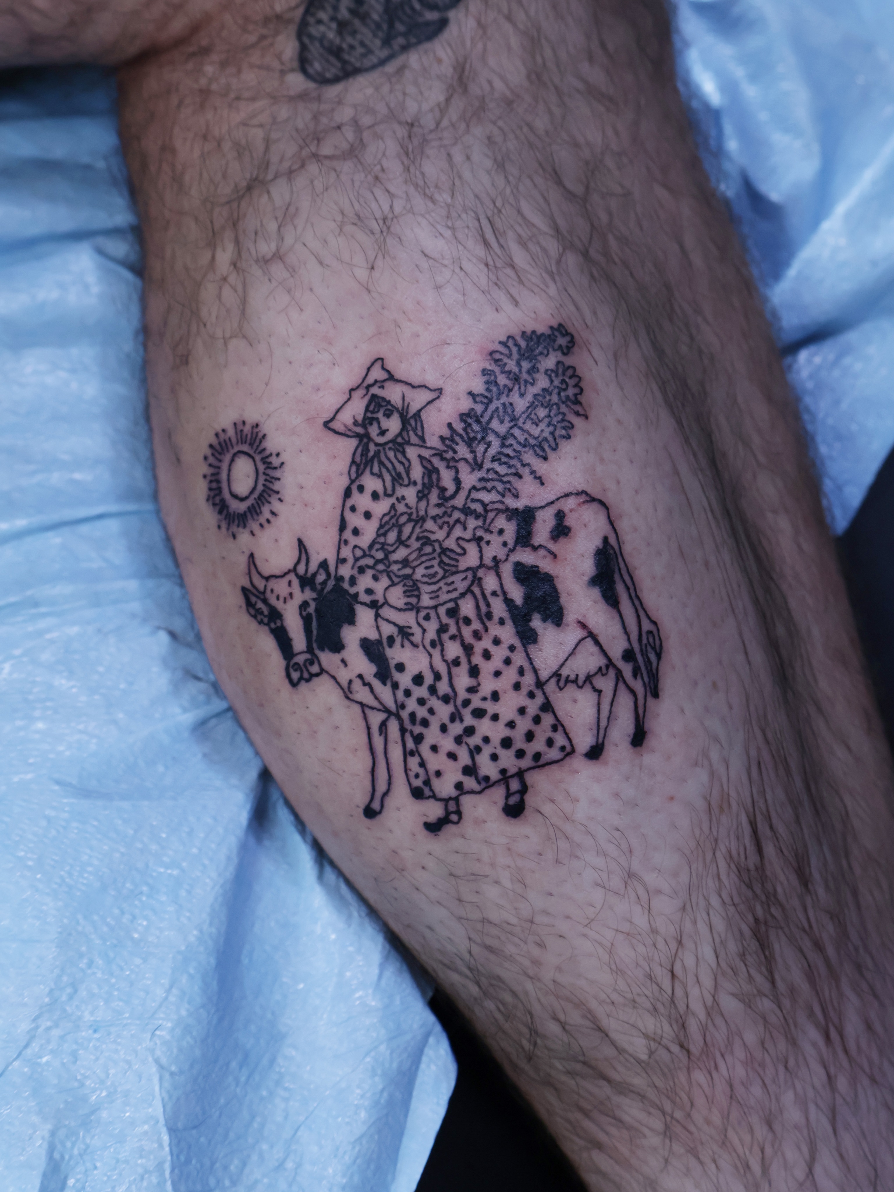 Cow and woman American traditional tattoo on the thigh by Denis Du Preez, East Williamsburg, Brooklyn