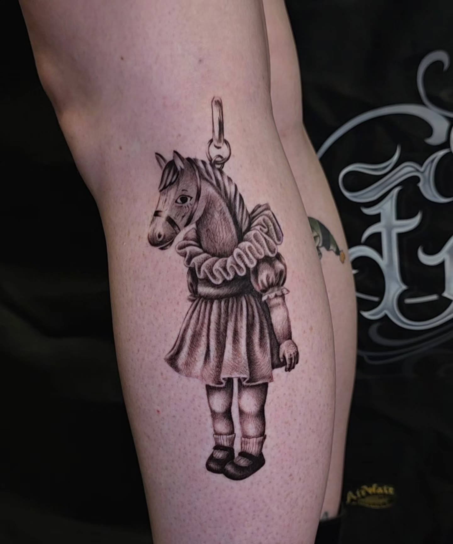 Horse in ruff black and grey tattoo on the thigh by Ashley Johnson, Knoxville, Tennessee