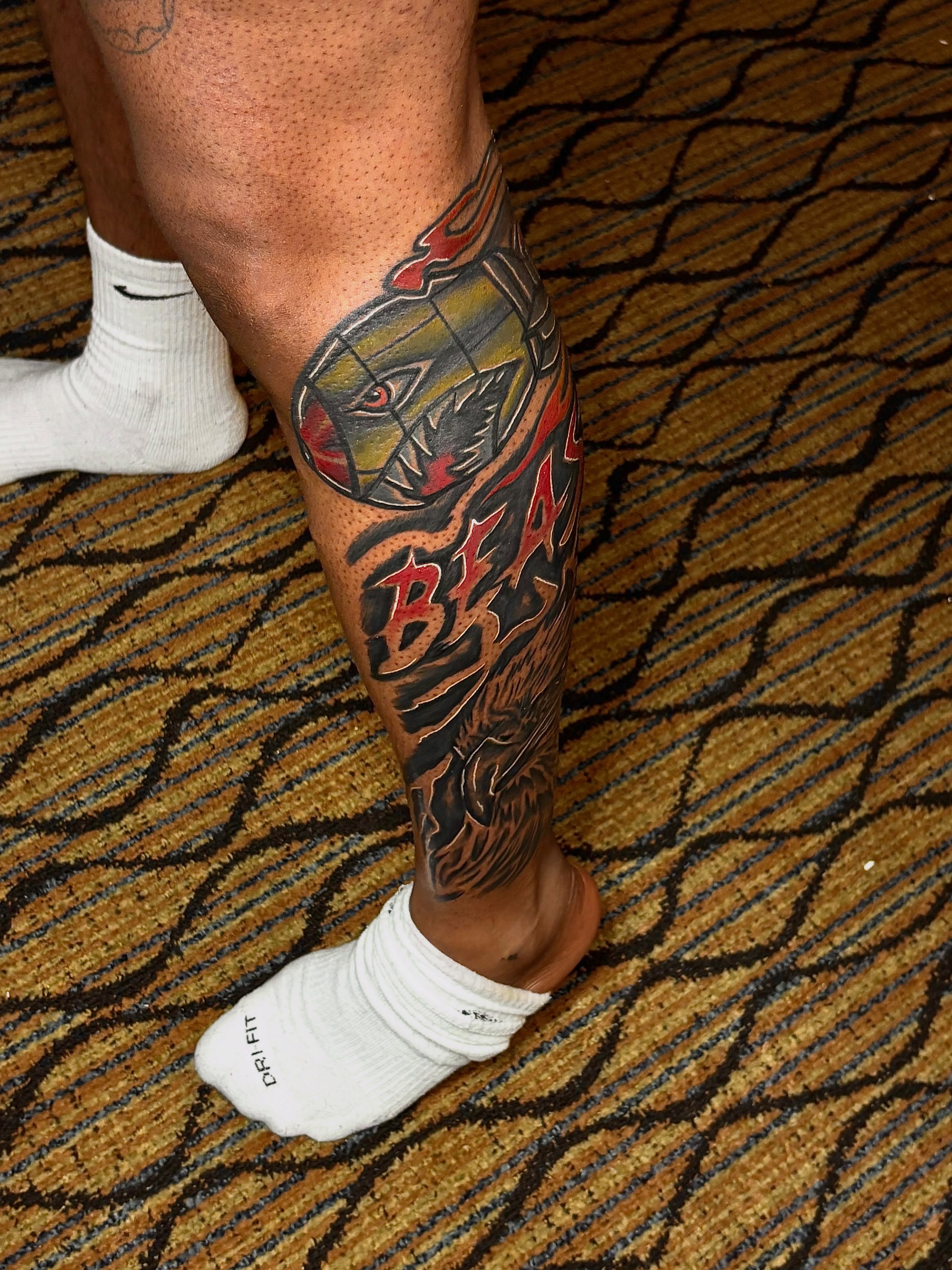Beast American traditional tattoo on the calf by Deonte Dwayne Durham