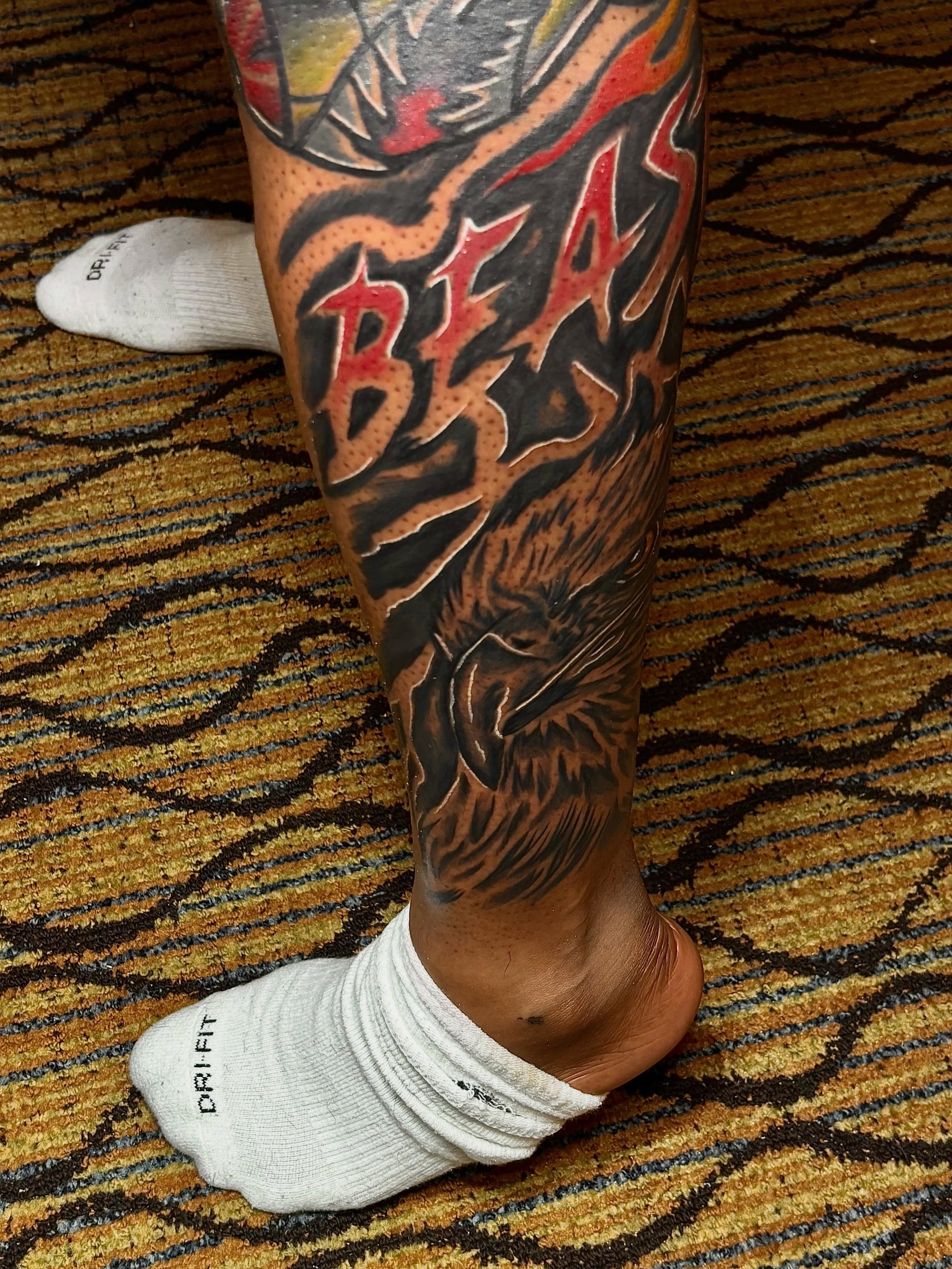 Beast American traditional tattoo on the calf by Deonte Dwayne Durham