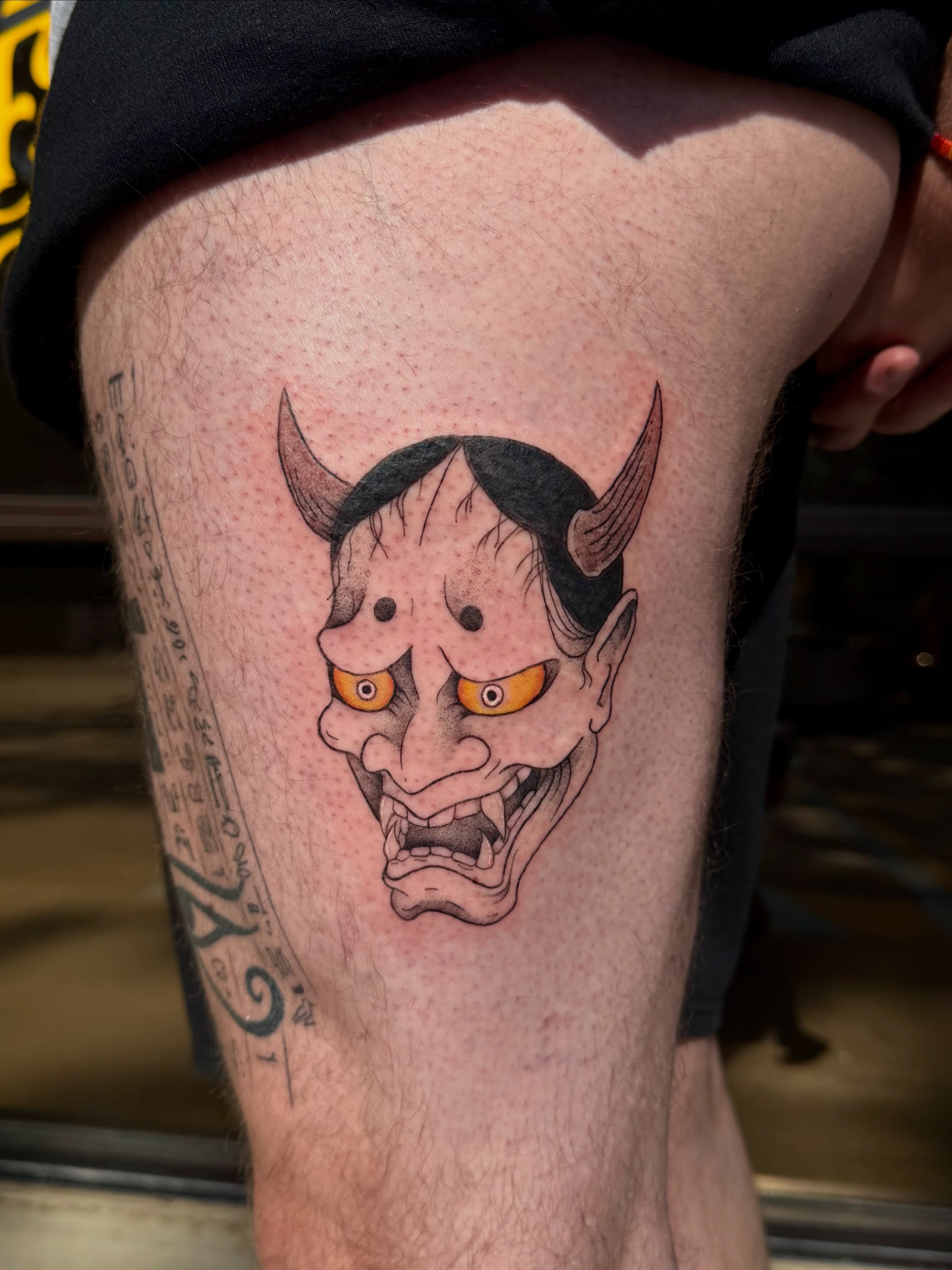 Demon mask realism tattoo on the thigh by Shay - Mandeville Tattoo Artist