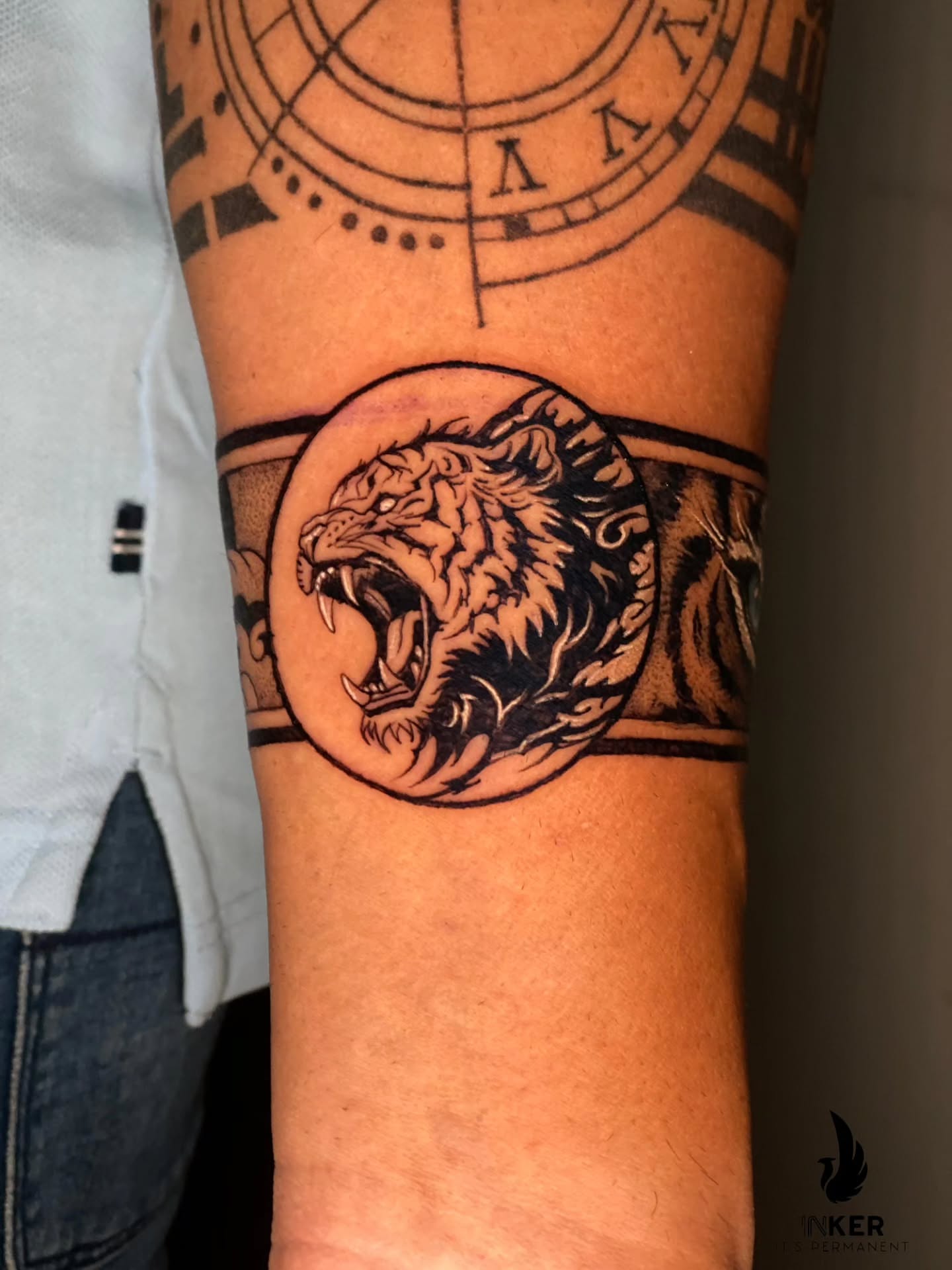 Roaring tiger black and grey tattoo on the forearm by Shubhadeep Mukherjee