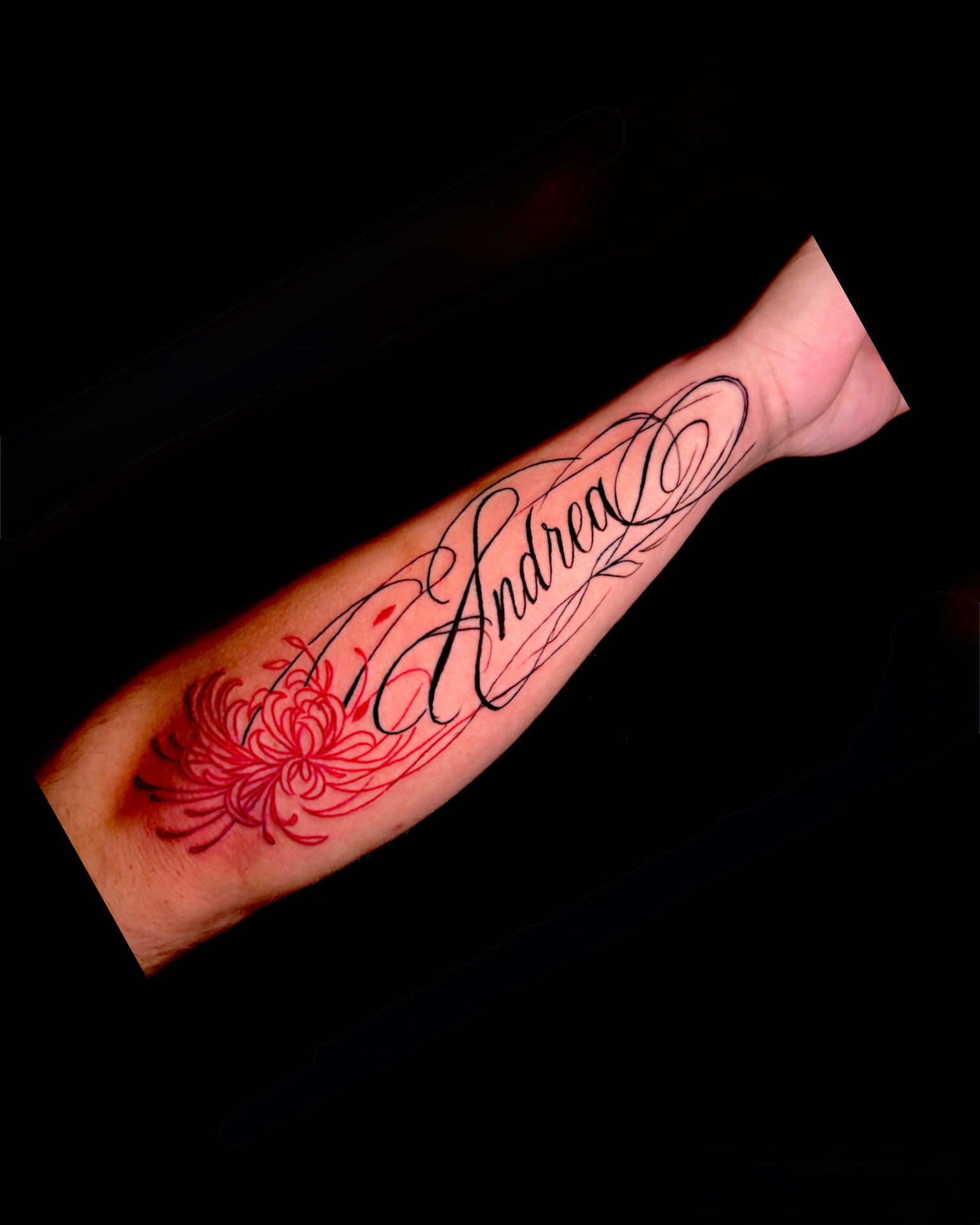 Name and floral design lettering script tattoo on the forearm by Caloy Obra