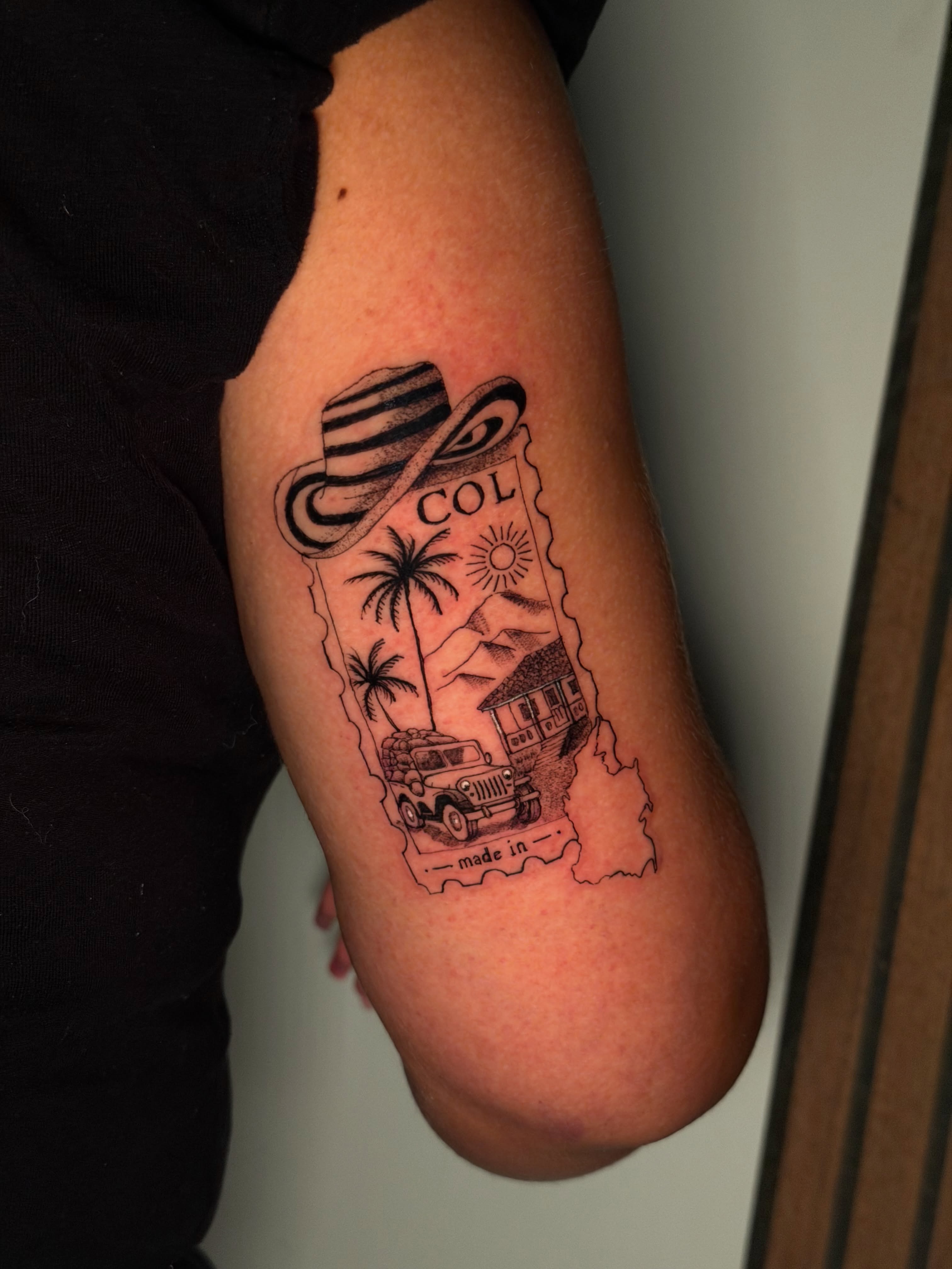 Travel-themed map black and grey tattoo on the forearm by Sebastian martinez, Memphis, Tennessee