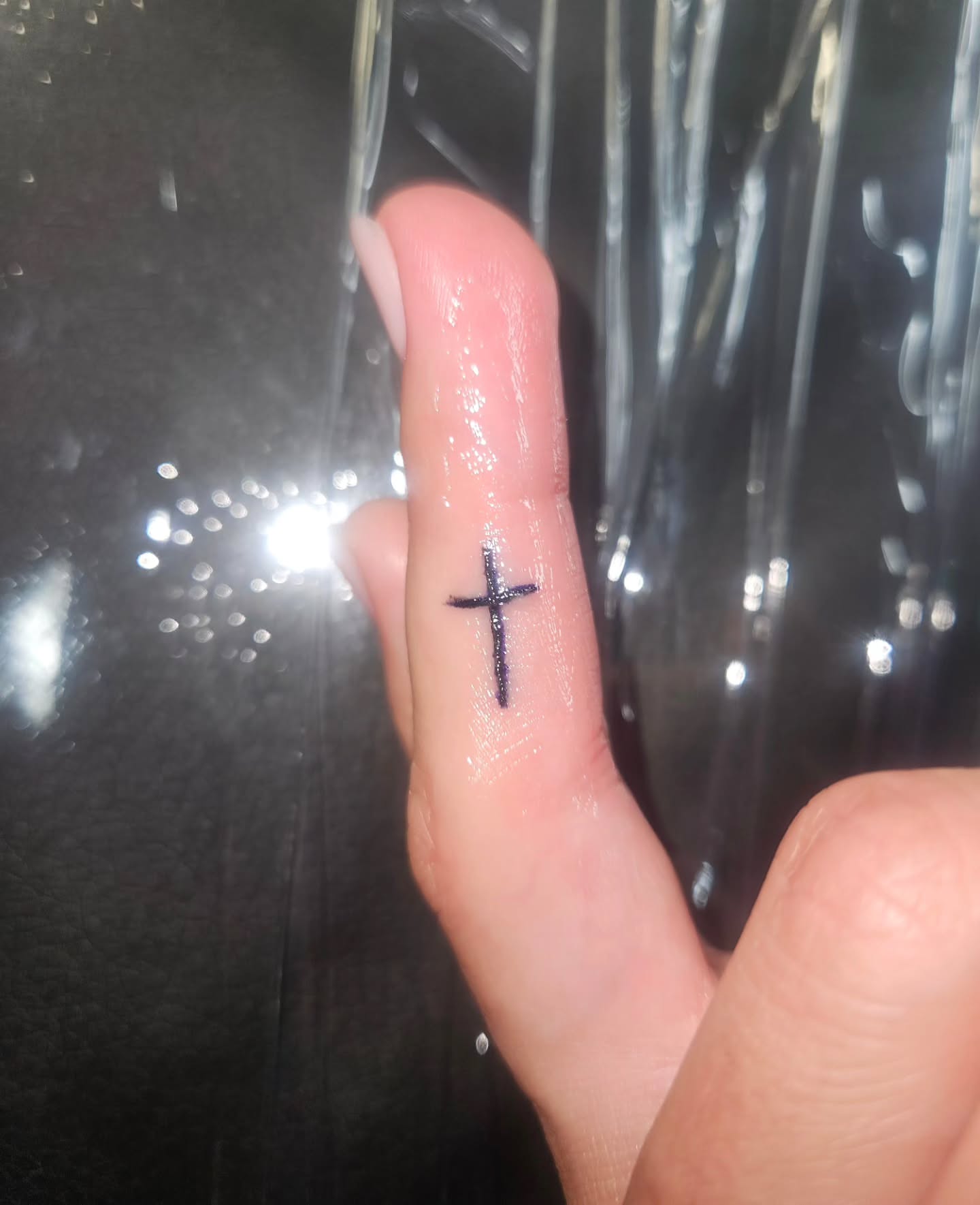 Cross fine line tattoo on the hand by Mischief π€