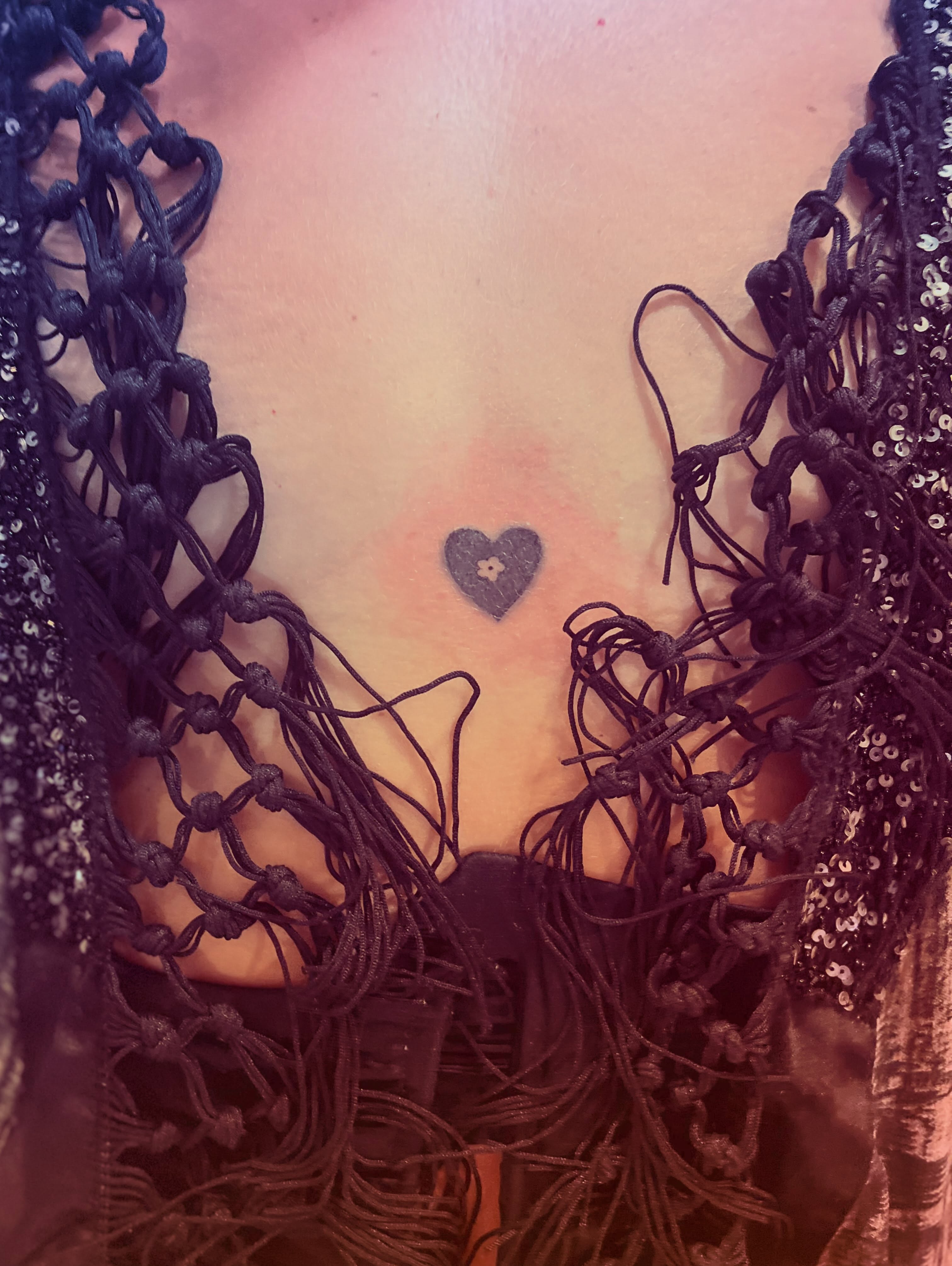 Heart black and grey tattoo on the chest by La Main Bleue