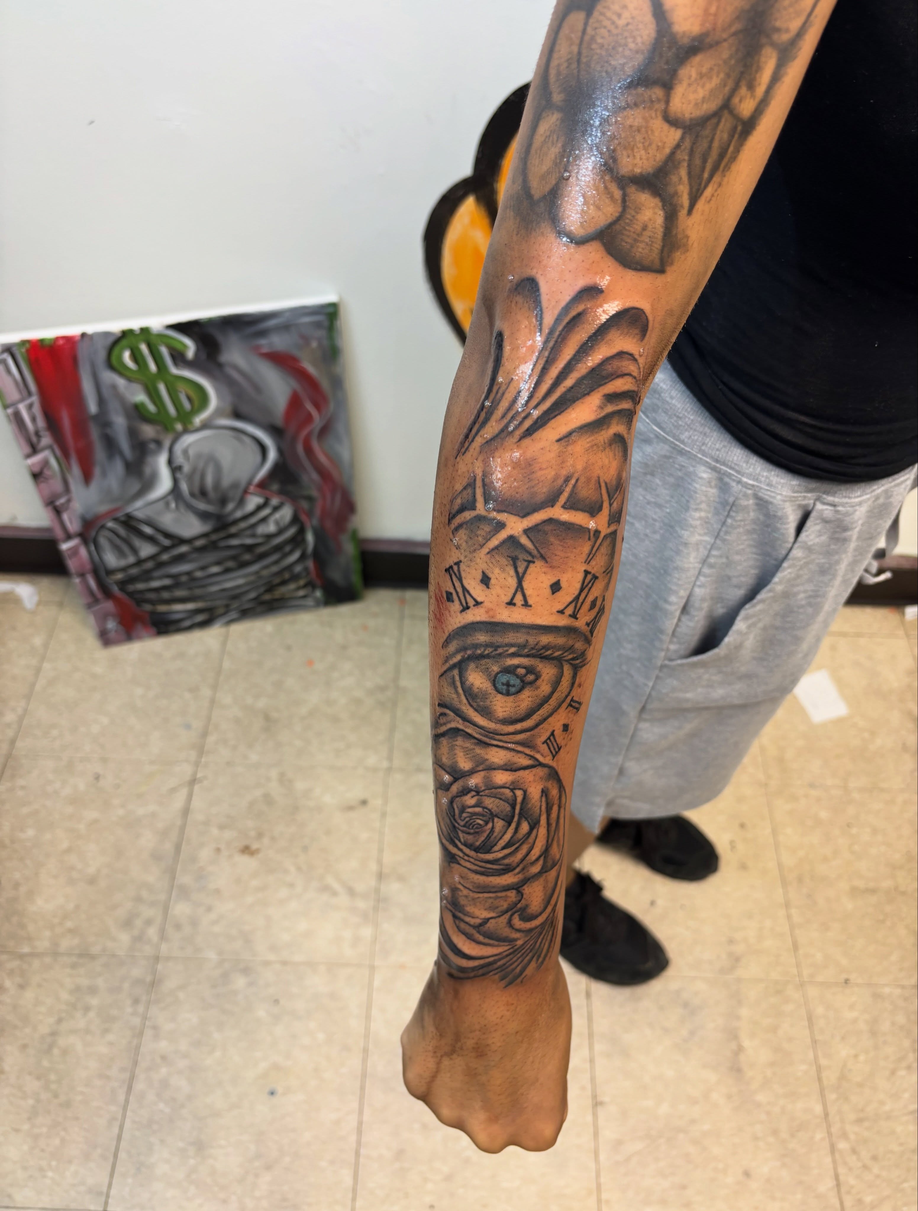 Eye and roses realism tattoo on the forearm by Exotic Motion🌪️