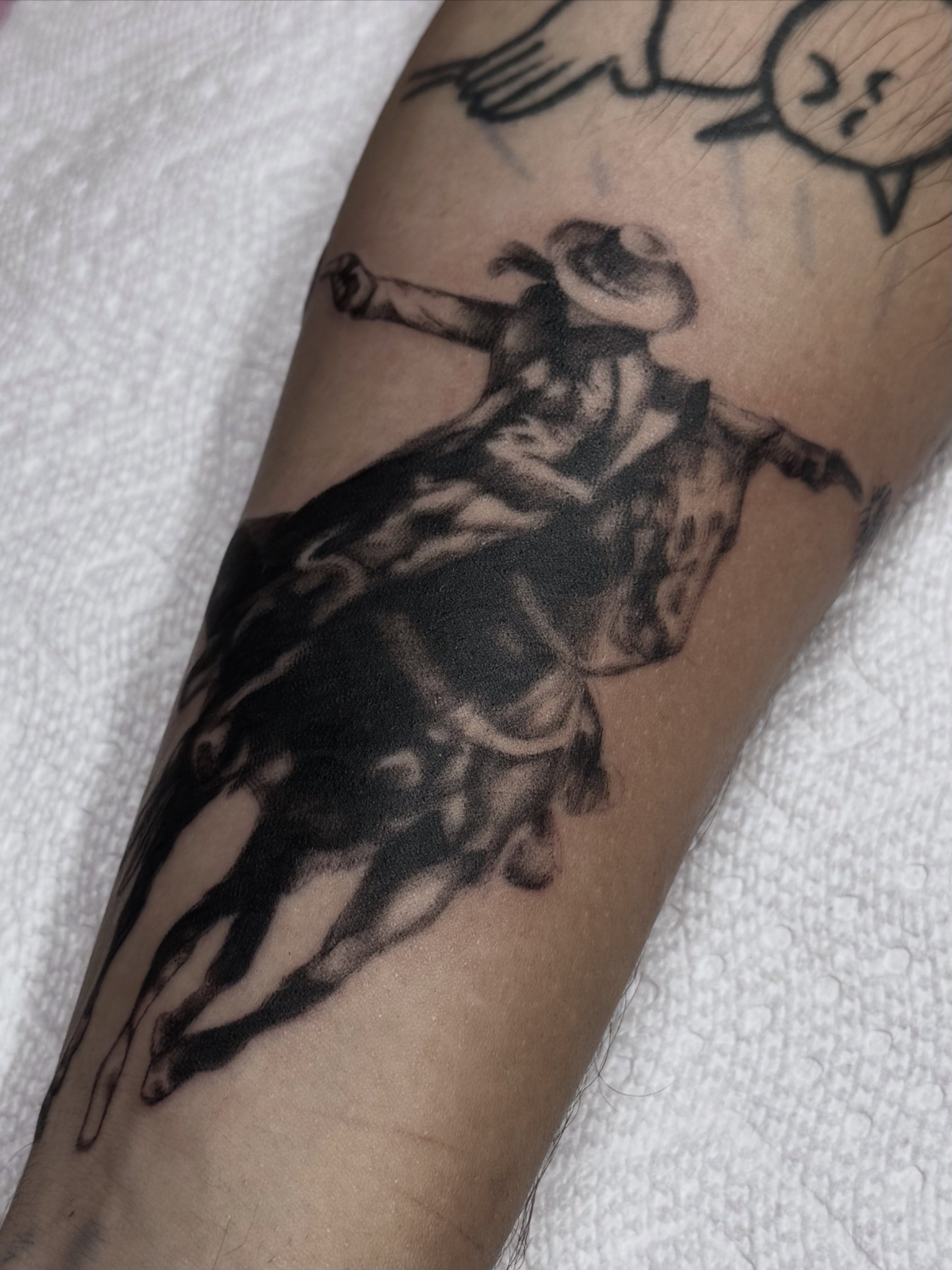 Bull rider black and grey tattoo on the forearm by Nat🫧