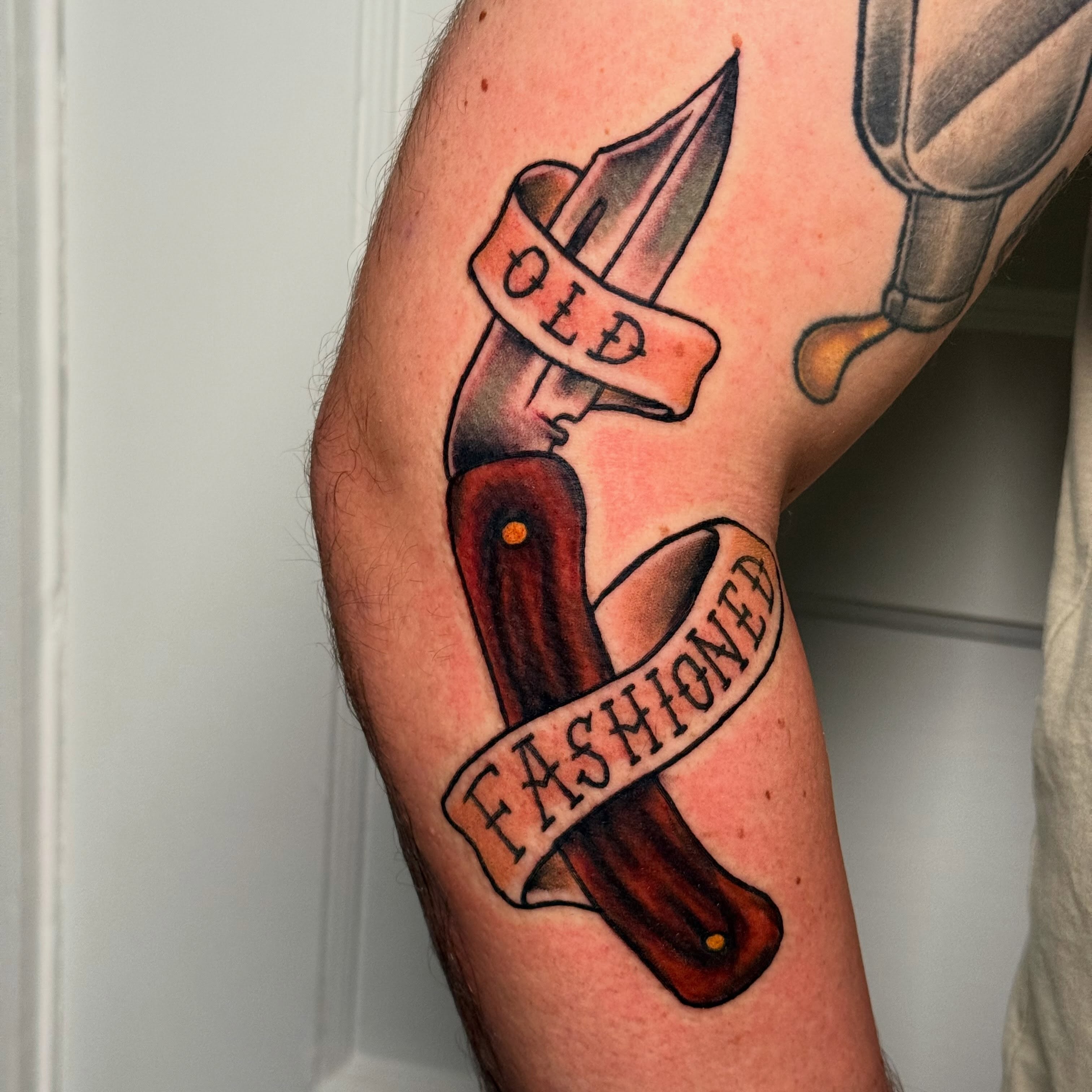 Old-fashioned knife American traditional tattoo on the forearm by Jeremy Carson