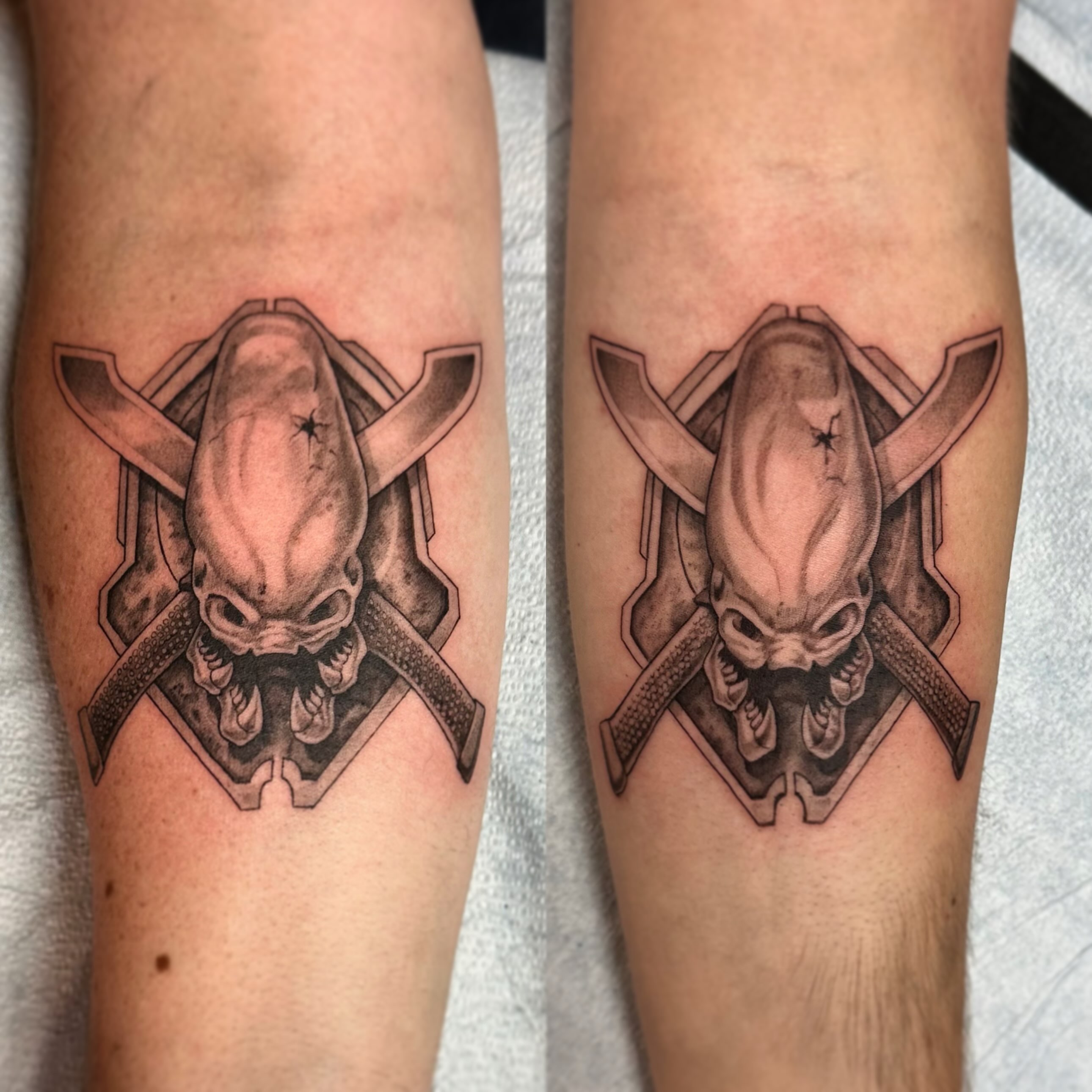 Alien head geometric tattoo on the forearm by Sebastian Livingston
