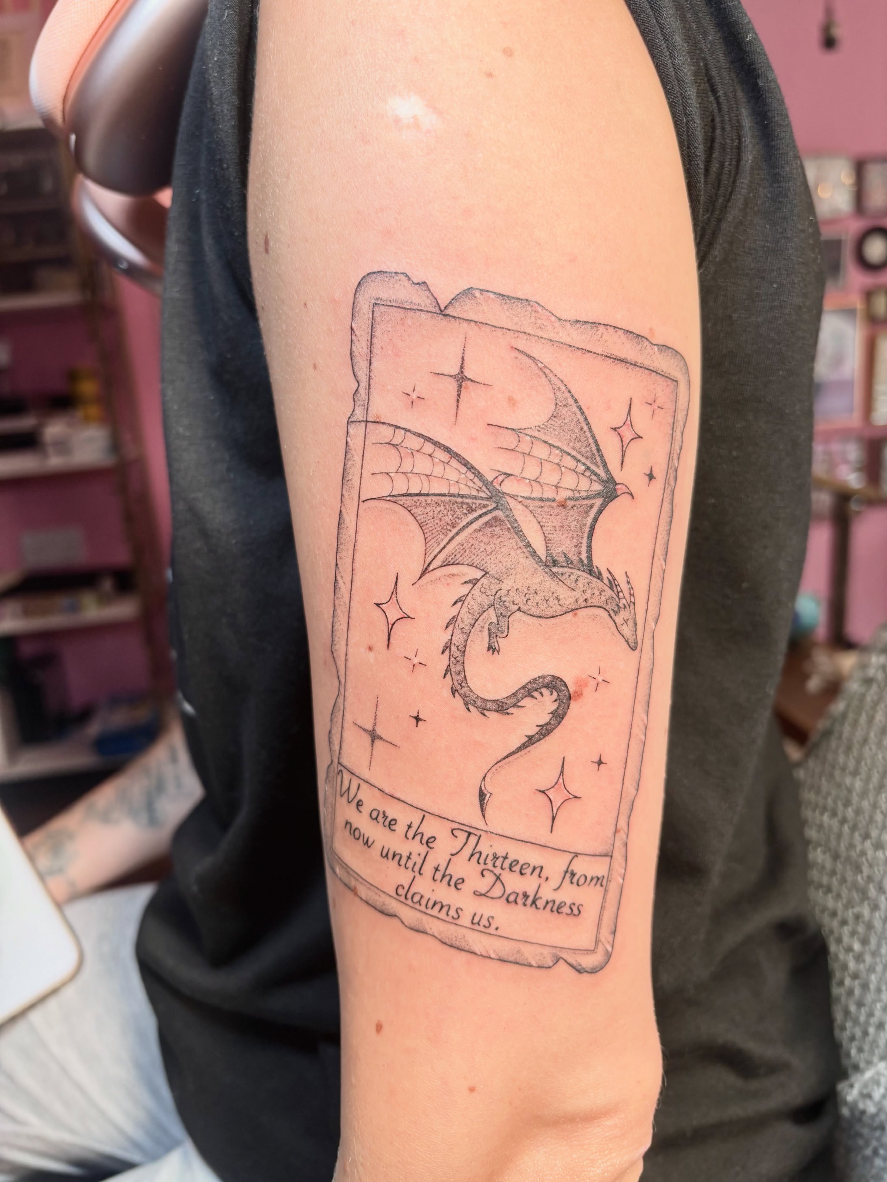 Dragon card black and grey tattoo on the forearm by Charlotte Brown, Leeds, England