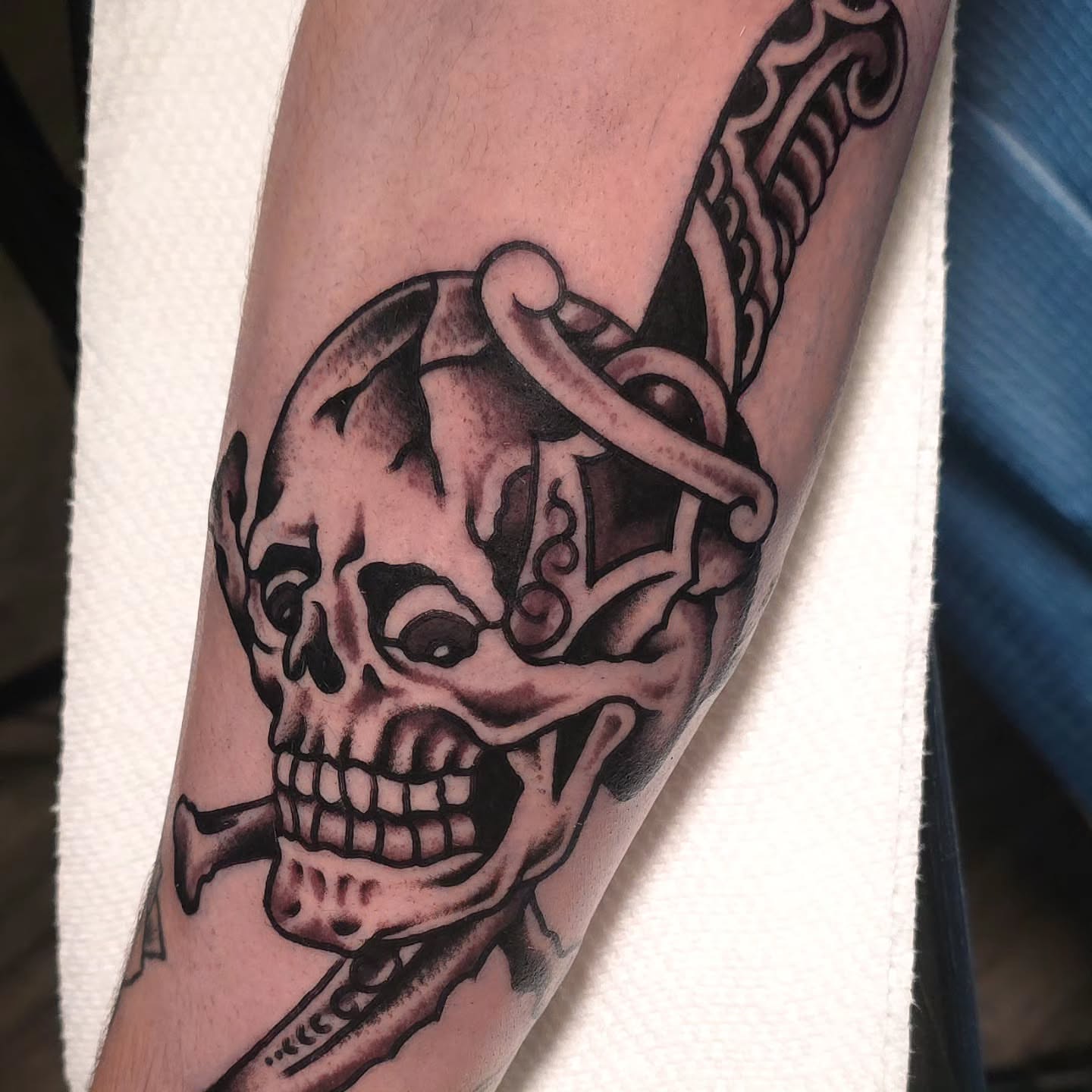 Skull and anchor black and grey tattoo on the forearm by J. Kirsch New Jersey Tattoo Artist