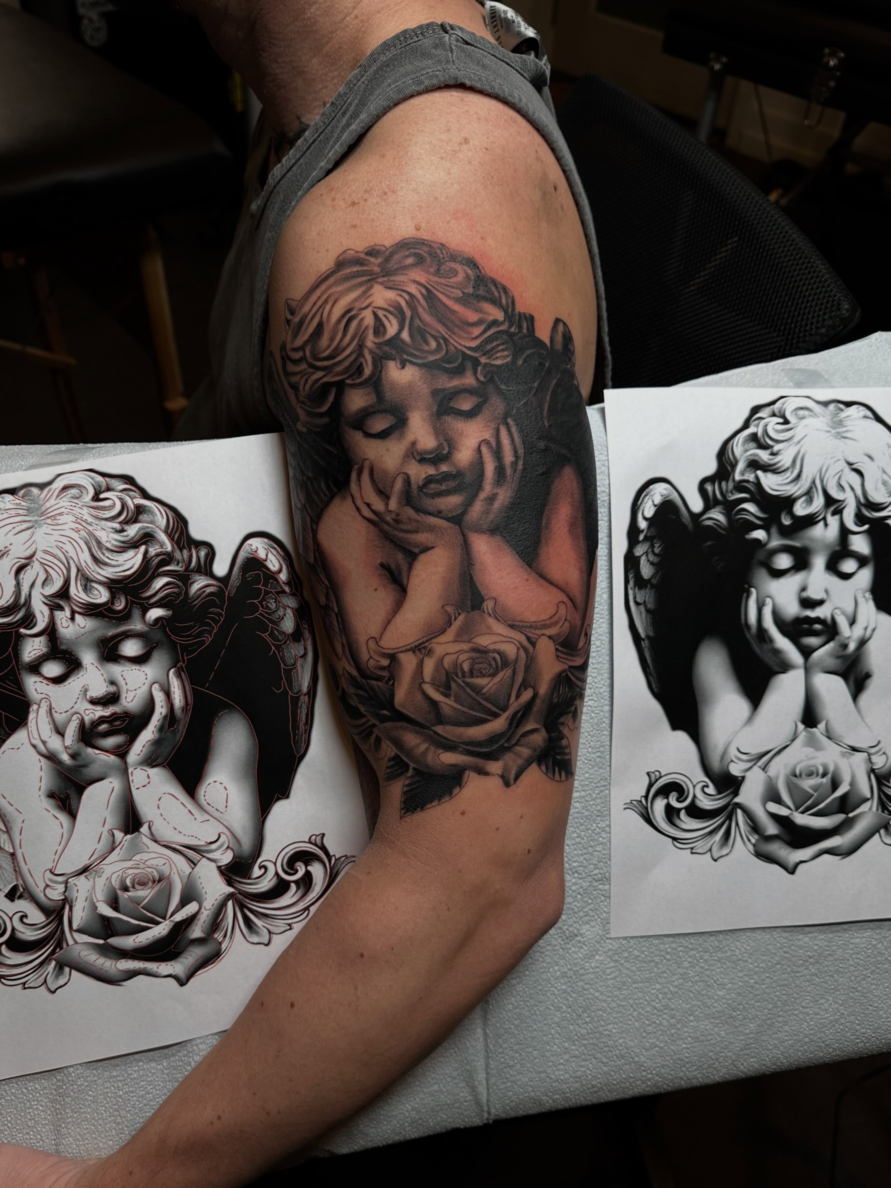 Angel with rose realism tattoo on the forearm by Nate Webb