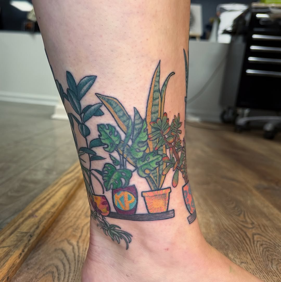 Houseplants new school tattoo on the calf by rocky love