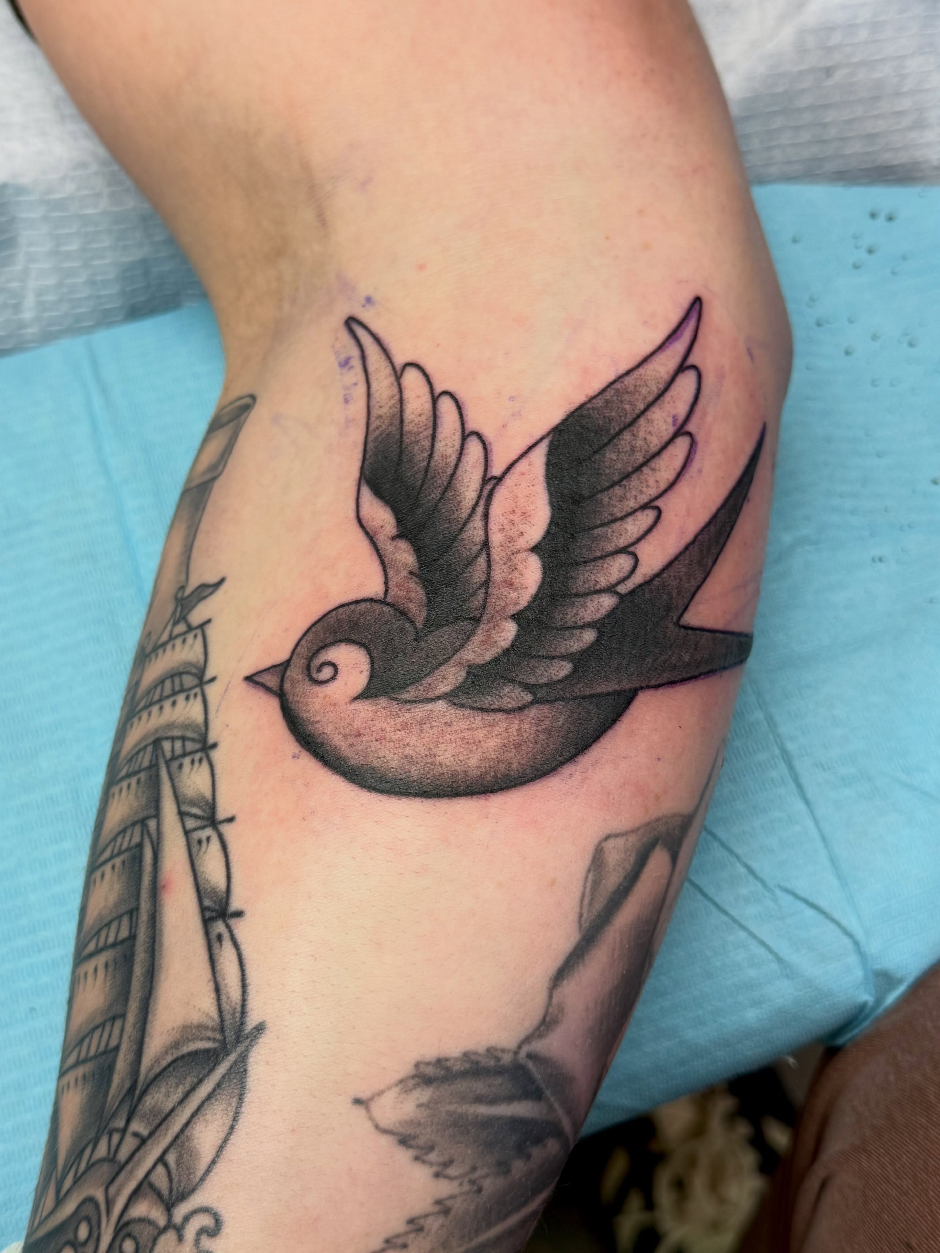 Swallow American traditional tattoo on the forearm by KevinBetsch