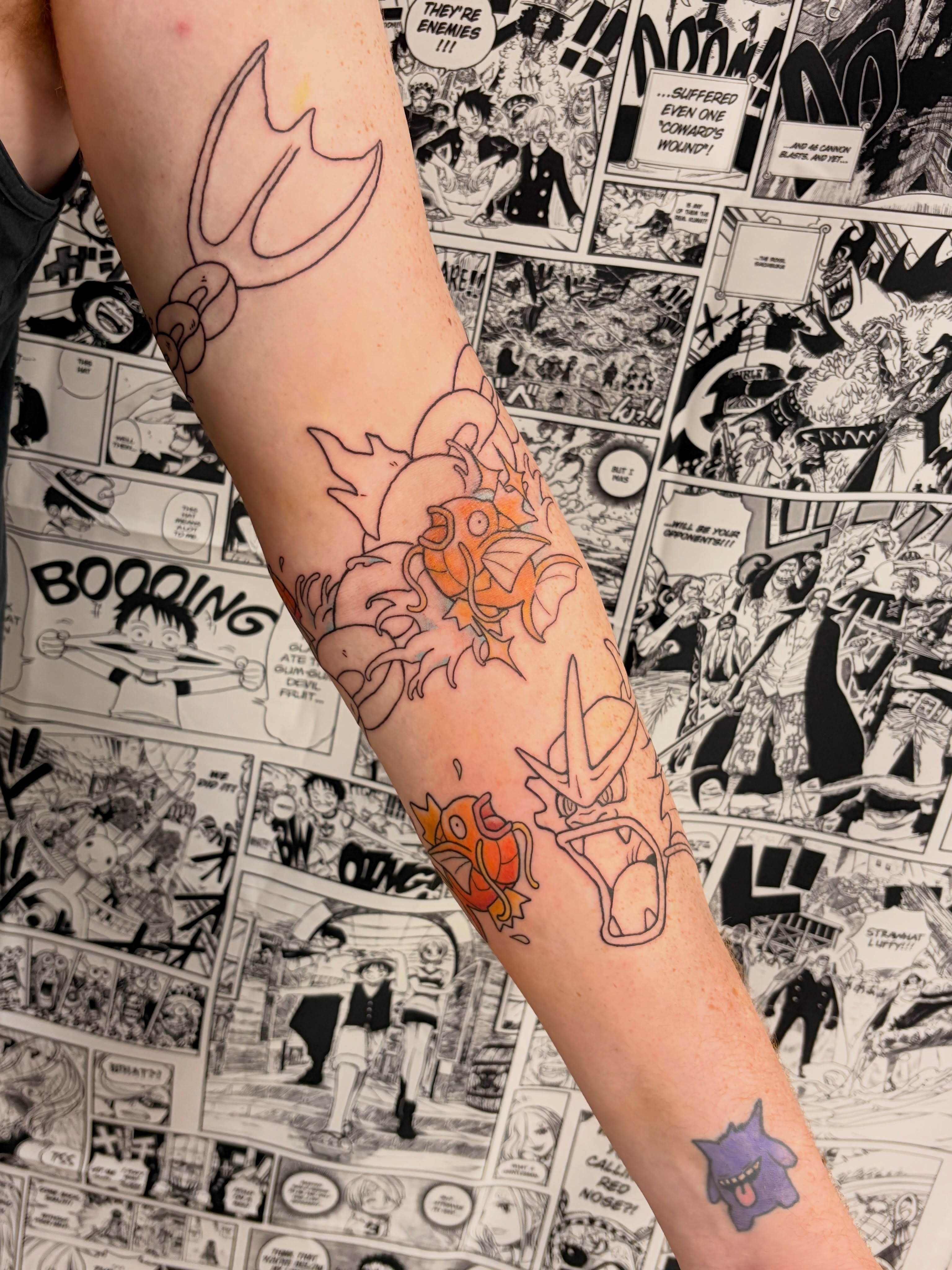 Anime characters anime tattoo on the forearm by Chris, Cleveland, Ohio
