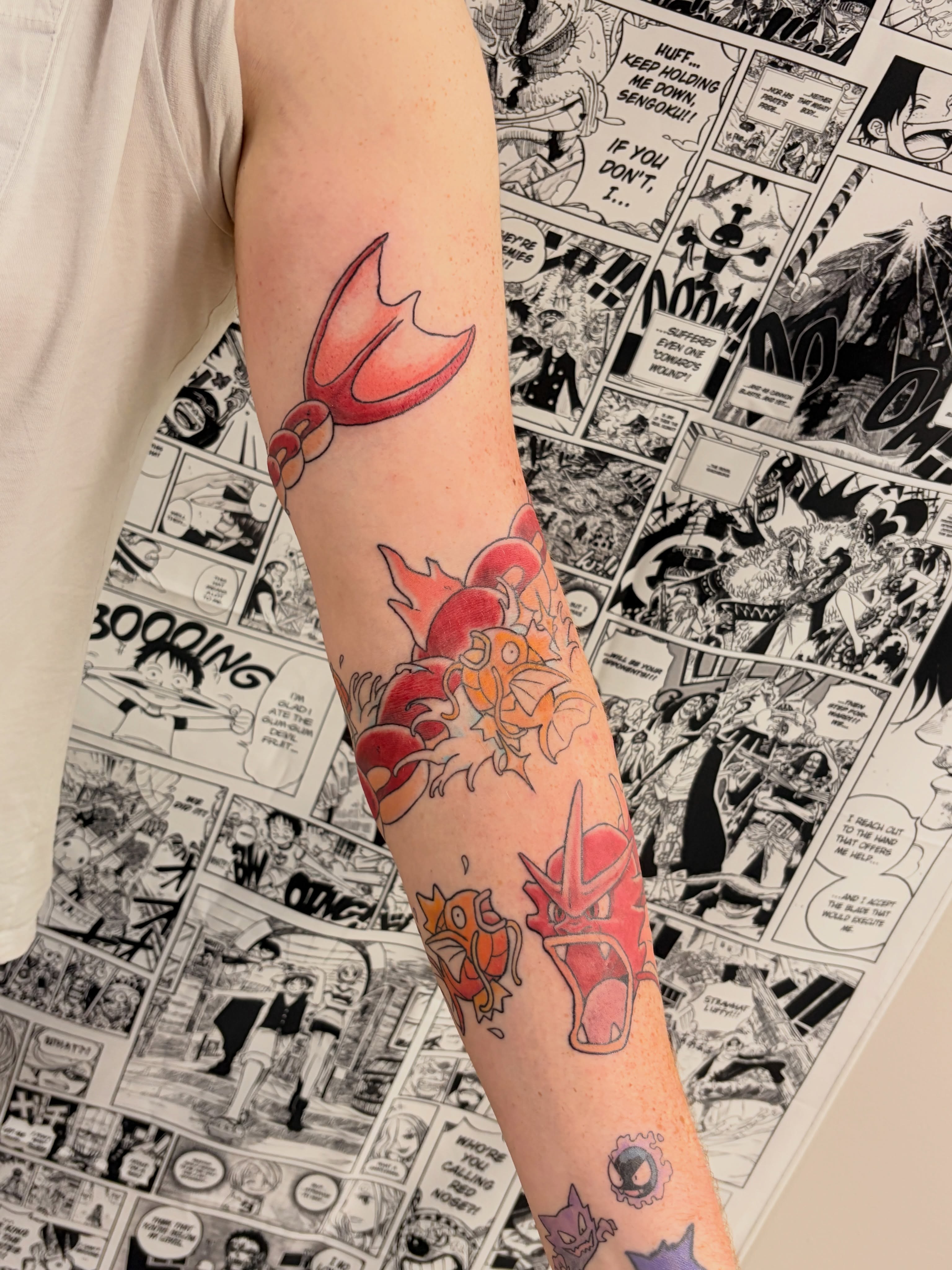 Koi fish anime tattoo on the forearm by Chris, Cleveland, Ohio