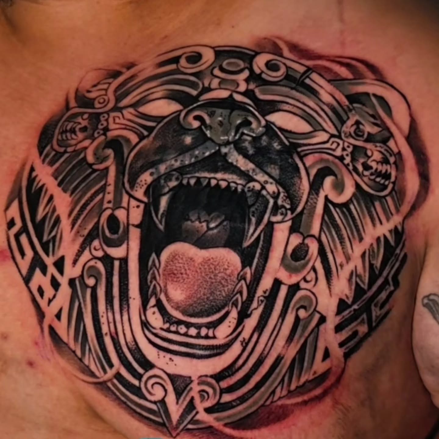 Roaring tiger geometric tattoo on the chest by Tattoo Seez, Wichita, Kansas