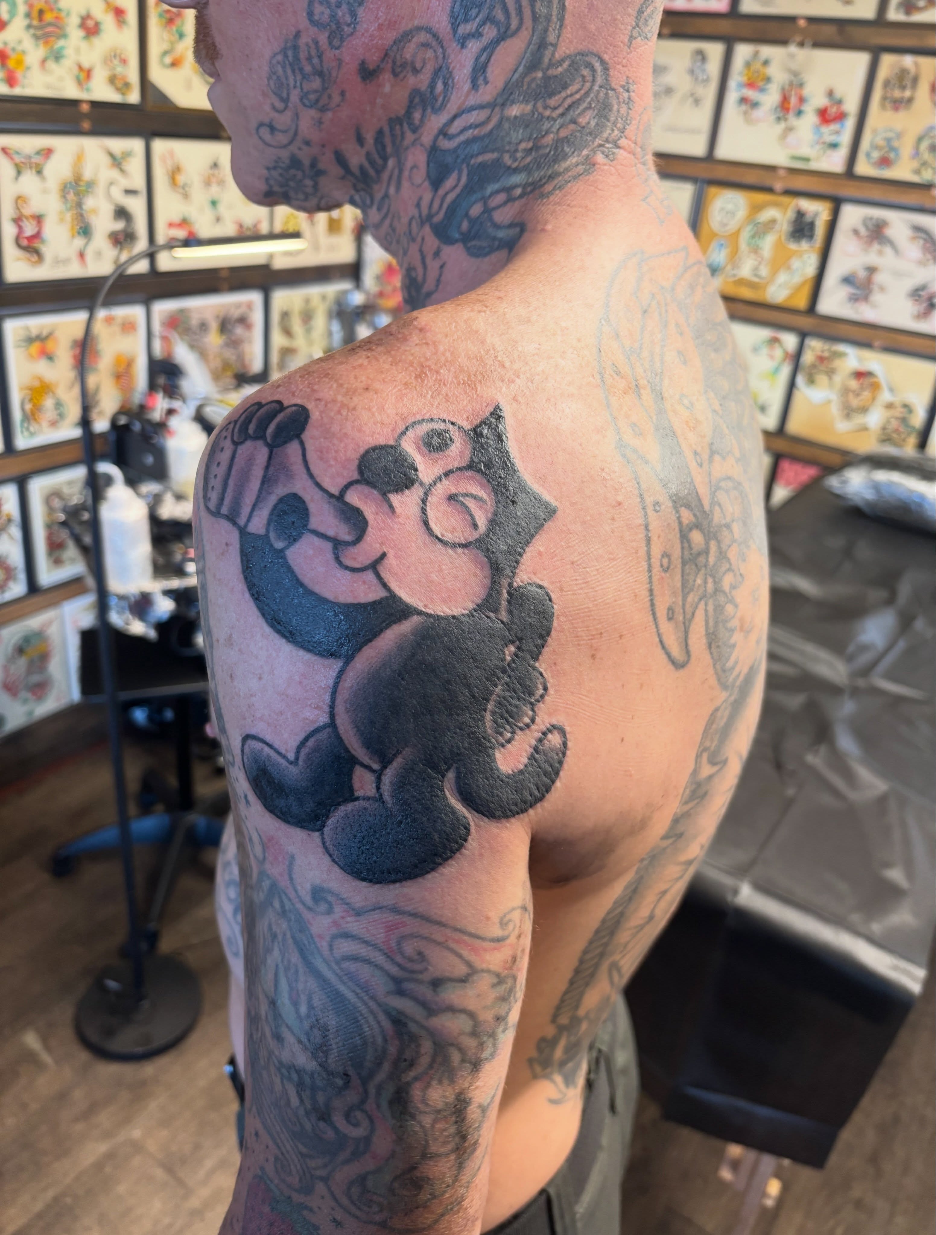 Mickey mouse American traditional tattoo on the shoulder by Las Vegas Tattoo Artist