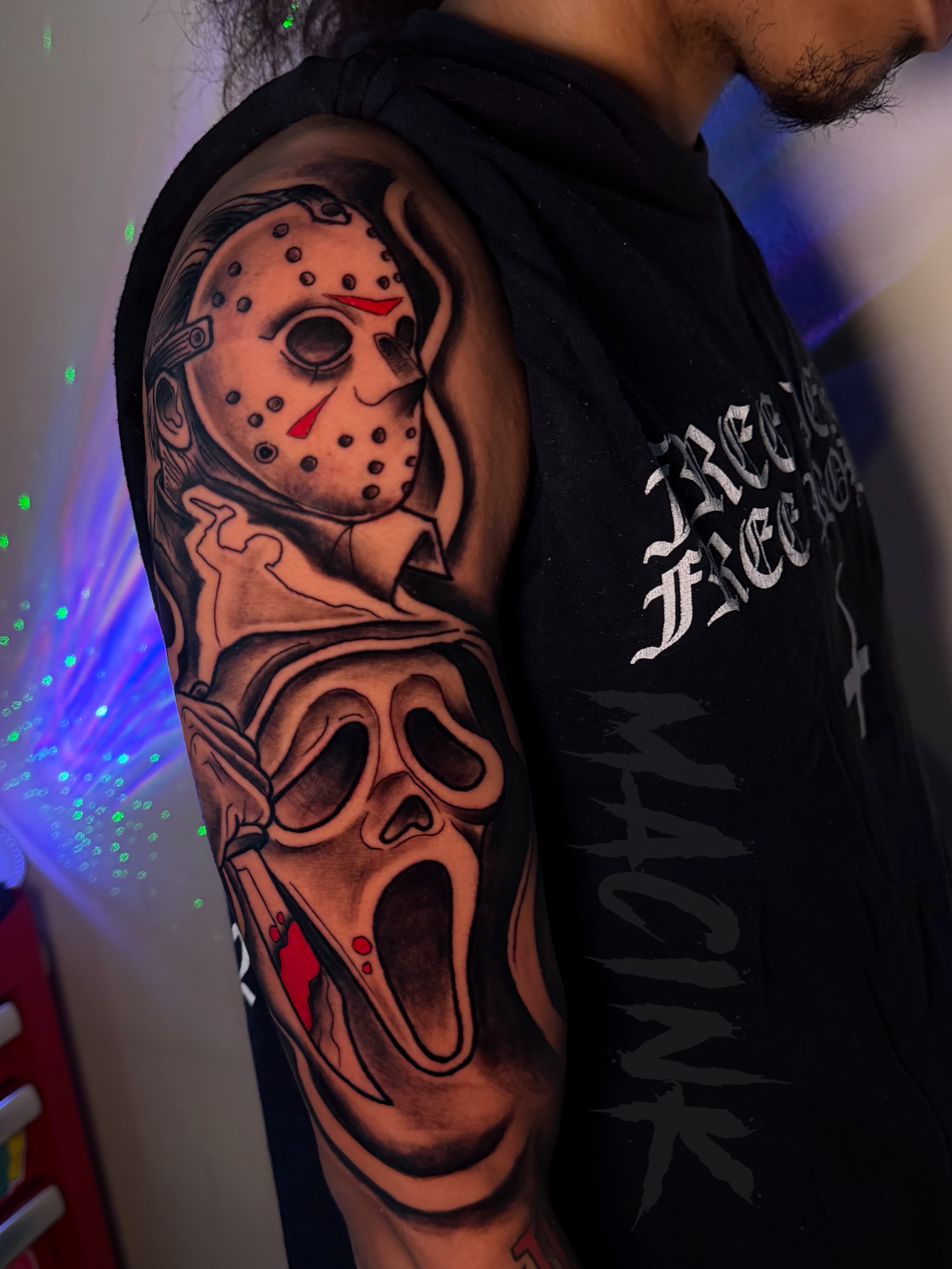 Jason voorhees and scream mask American traditional tattoo on the upper arm by ATL Tattoo Artist💲