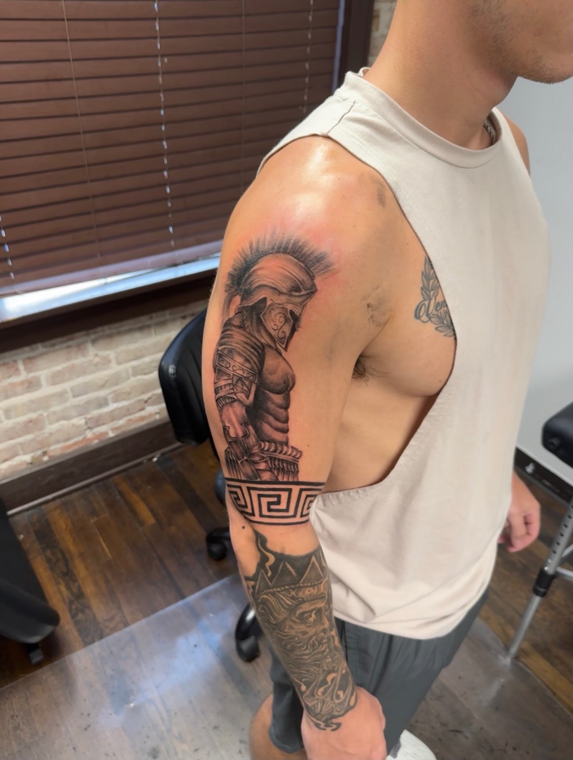 Warrior black and grey tattoo on the upper arm by Willi Tattoos👹