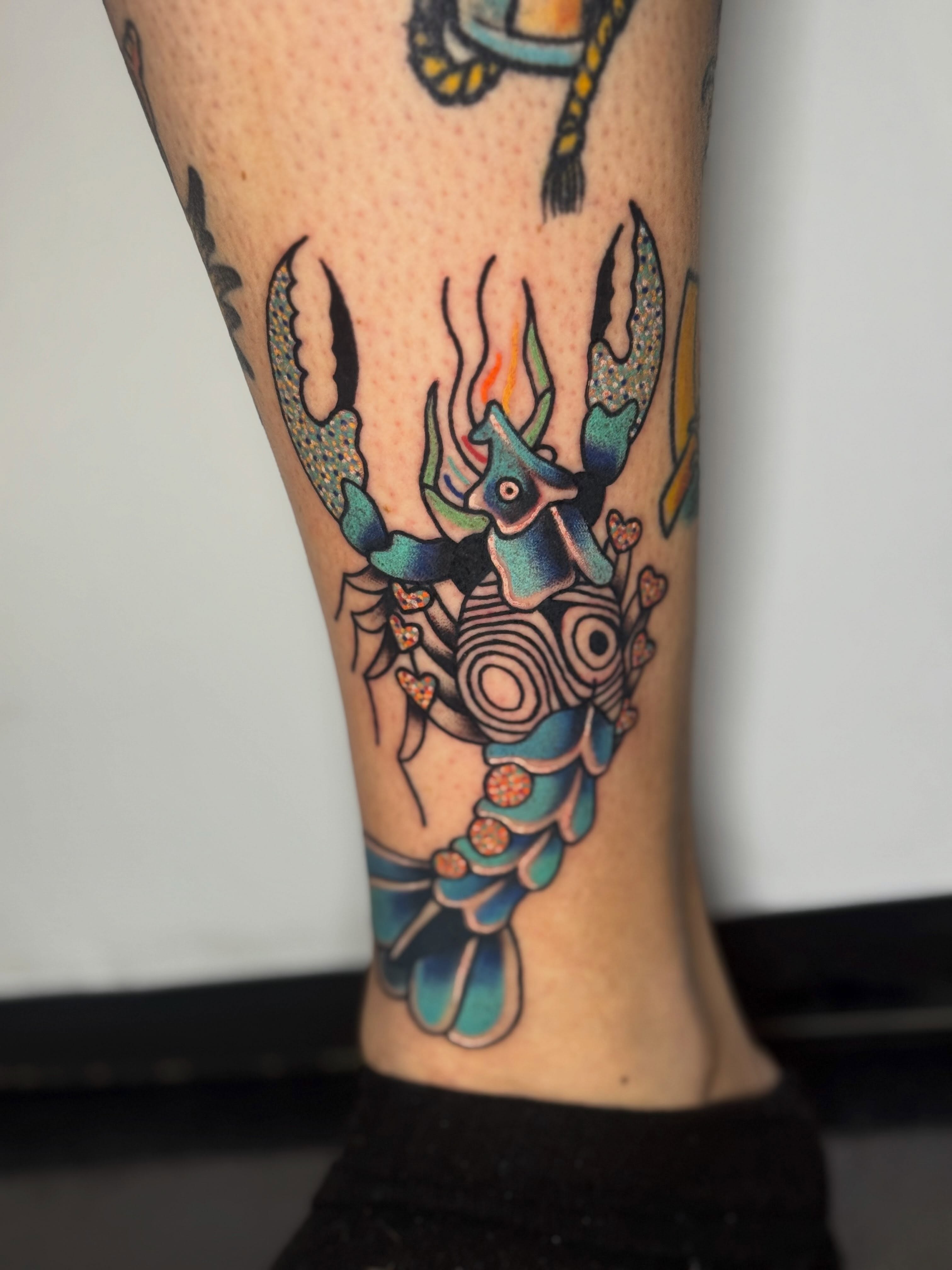 Crab geometric tattoo on the calf by Diana Muresan