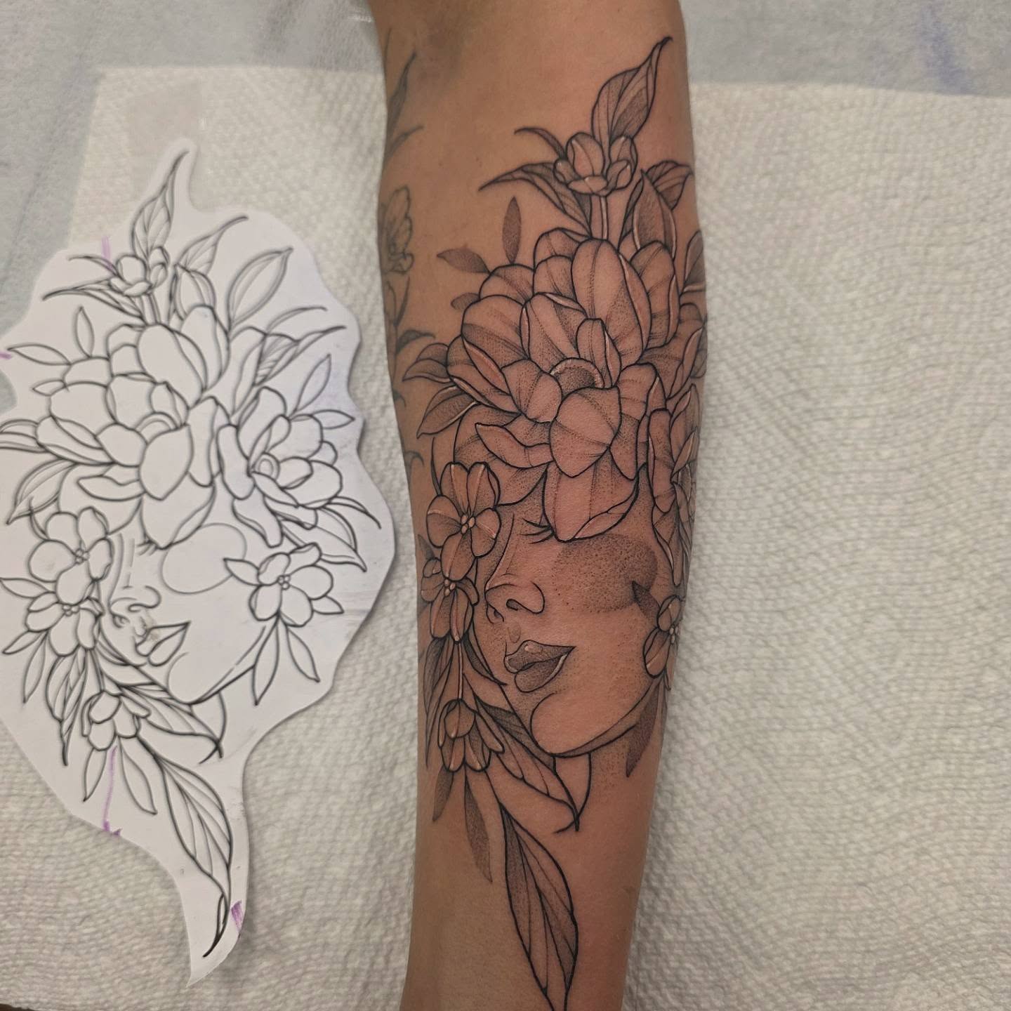 Floral bouquet black and grey tattoo on the forearm by Dani Bond