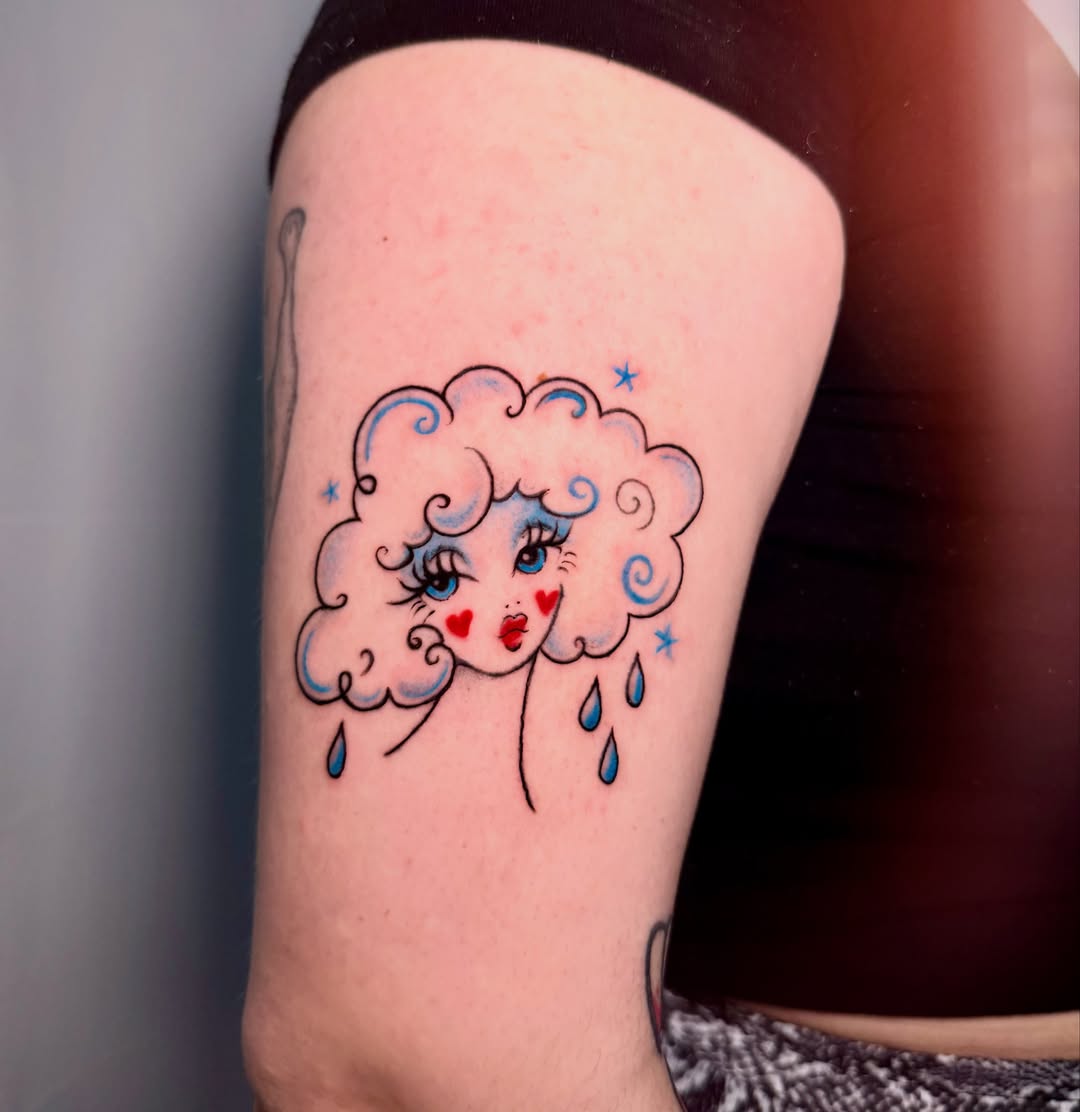 Cloud with face new school tattoo on the thigh by tattooz by megz
