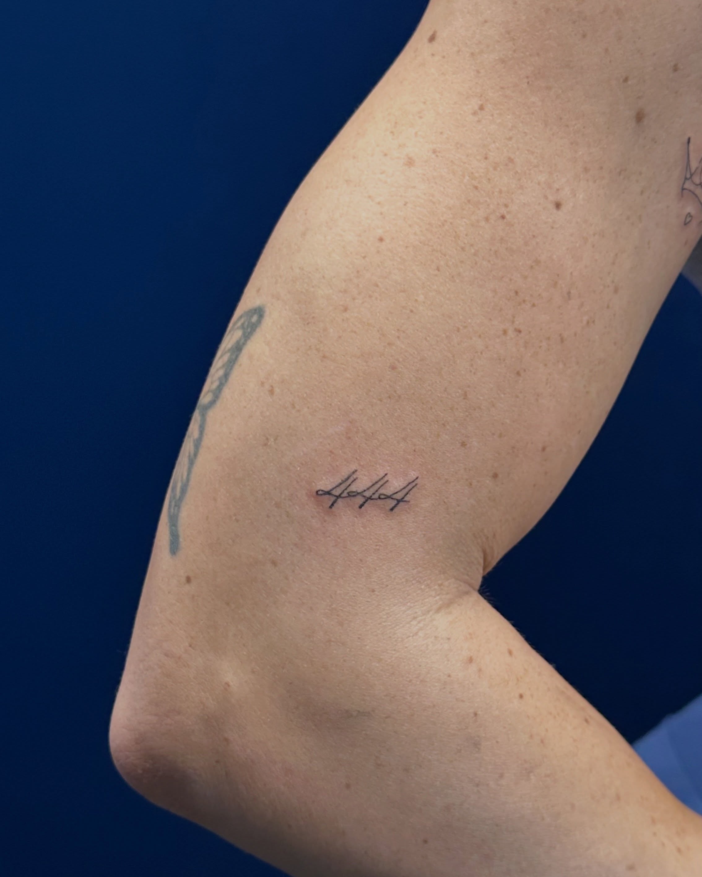Signature fine line tattoo on the forearm by Tattoo Takayo