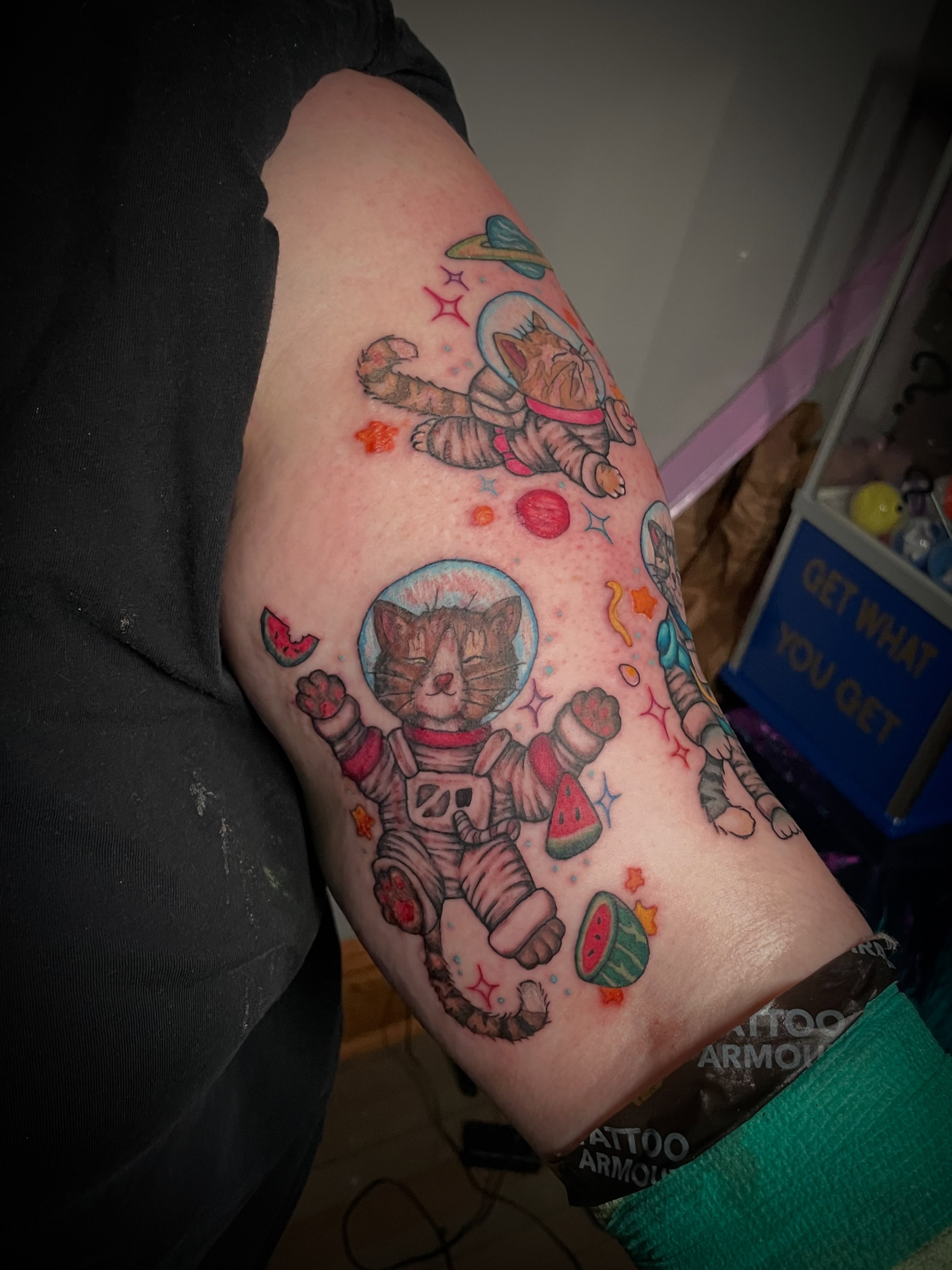 Astronaut cat new school tattoo on the forearm by Hannah Copeskey