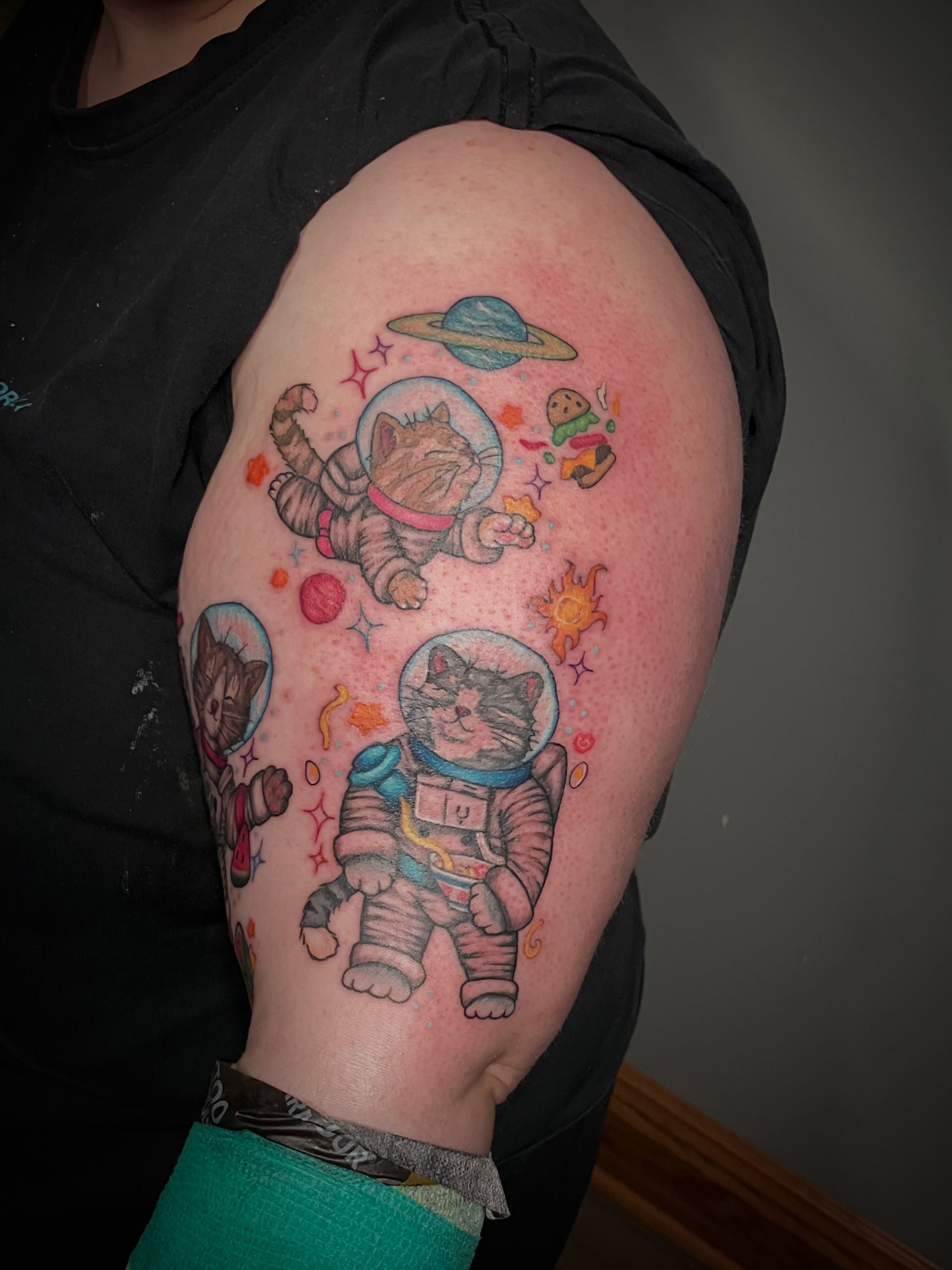 Space cats new school tattoo on the shoulder by Hannah Copeskey