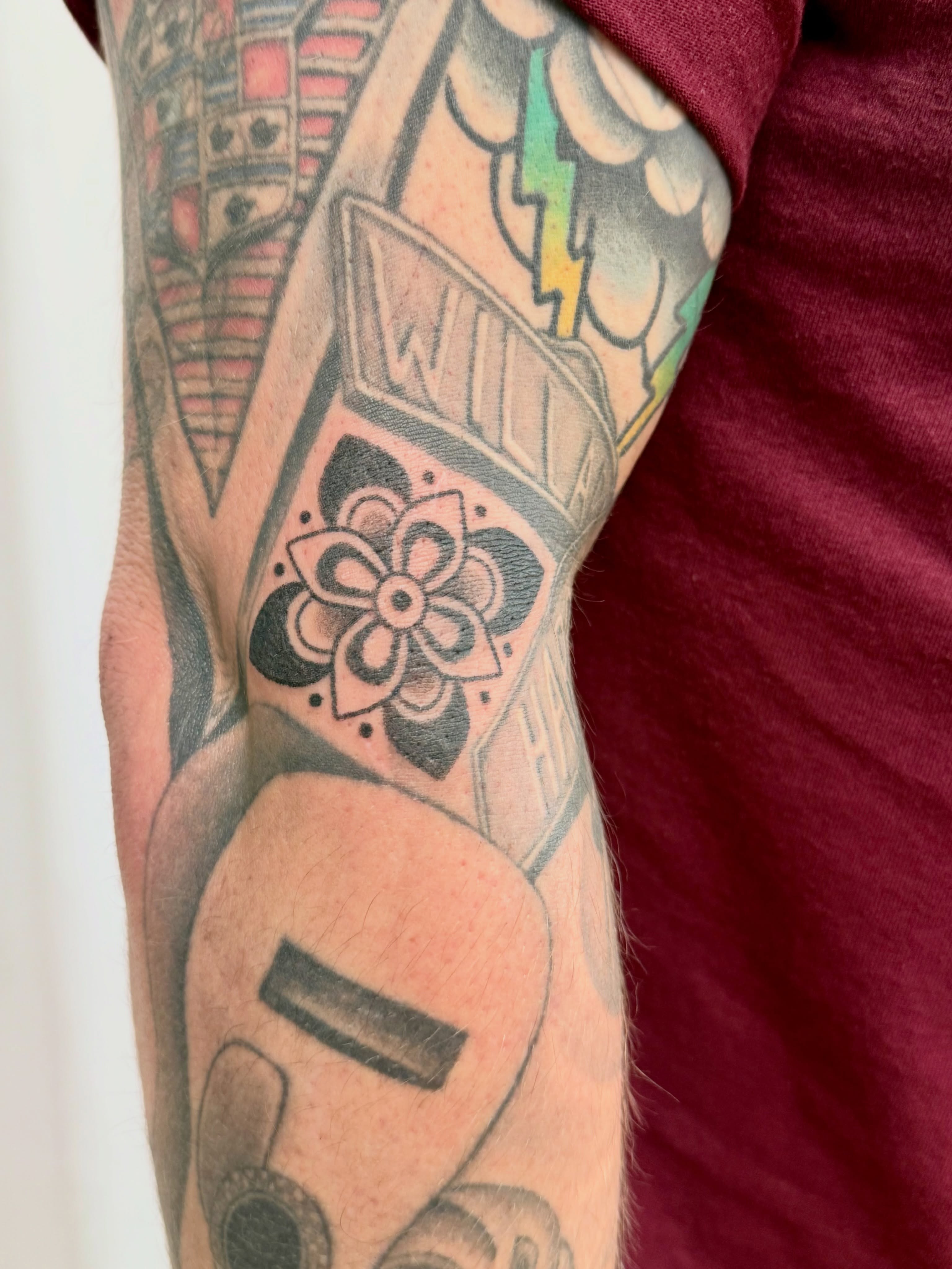 Flower black and grey tattoo on the forearm by Melia Mariko
